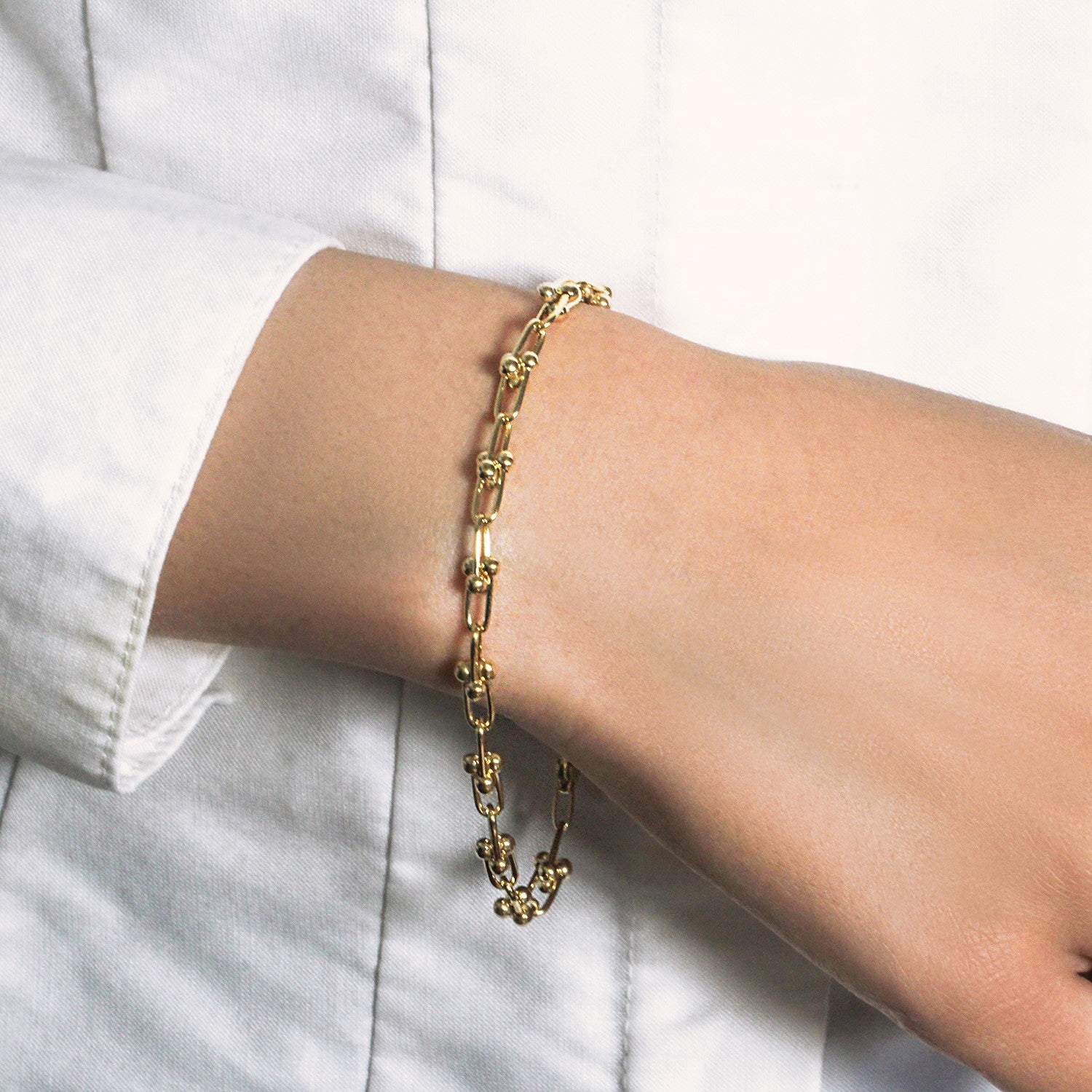 14k yellow gold Jax chain bracelet featuring modern link design, 7 1/2 inches, elegant and versatile for any occasion.
