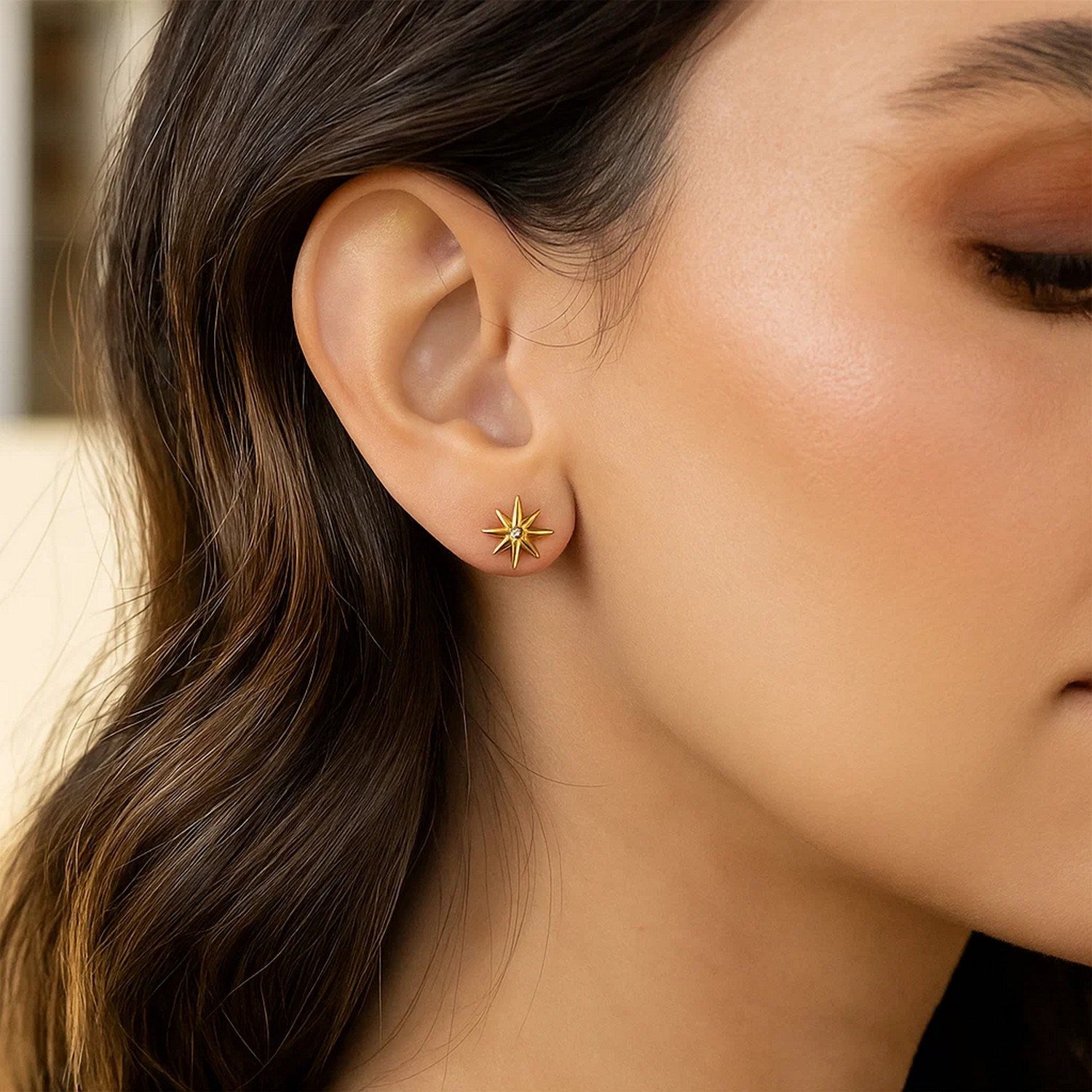 Elegant 14k yellow gold diamond North Star earrings showcasing exquisite craftsmanship and luxurious design.
