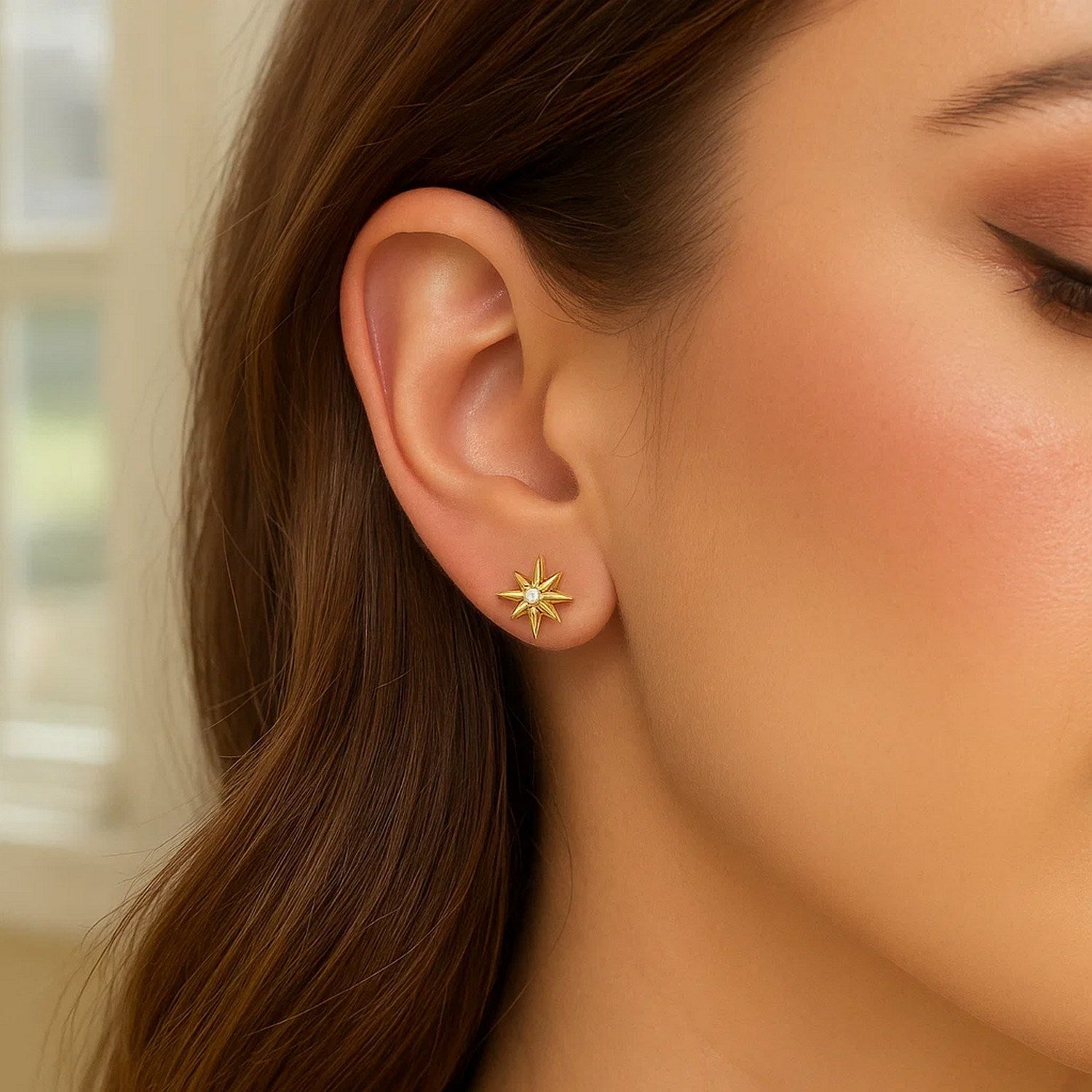 14k yellow gold diamond North Star earrings featuring elegant drop design and sparkling gemstones for a luxurious touch.