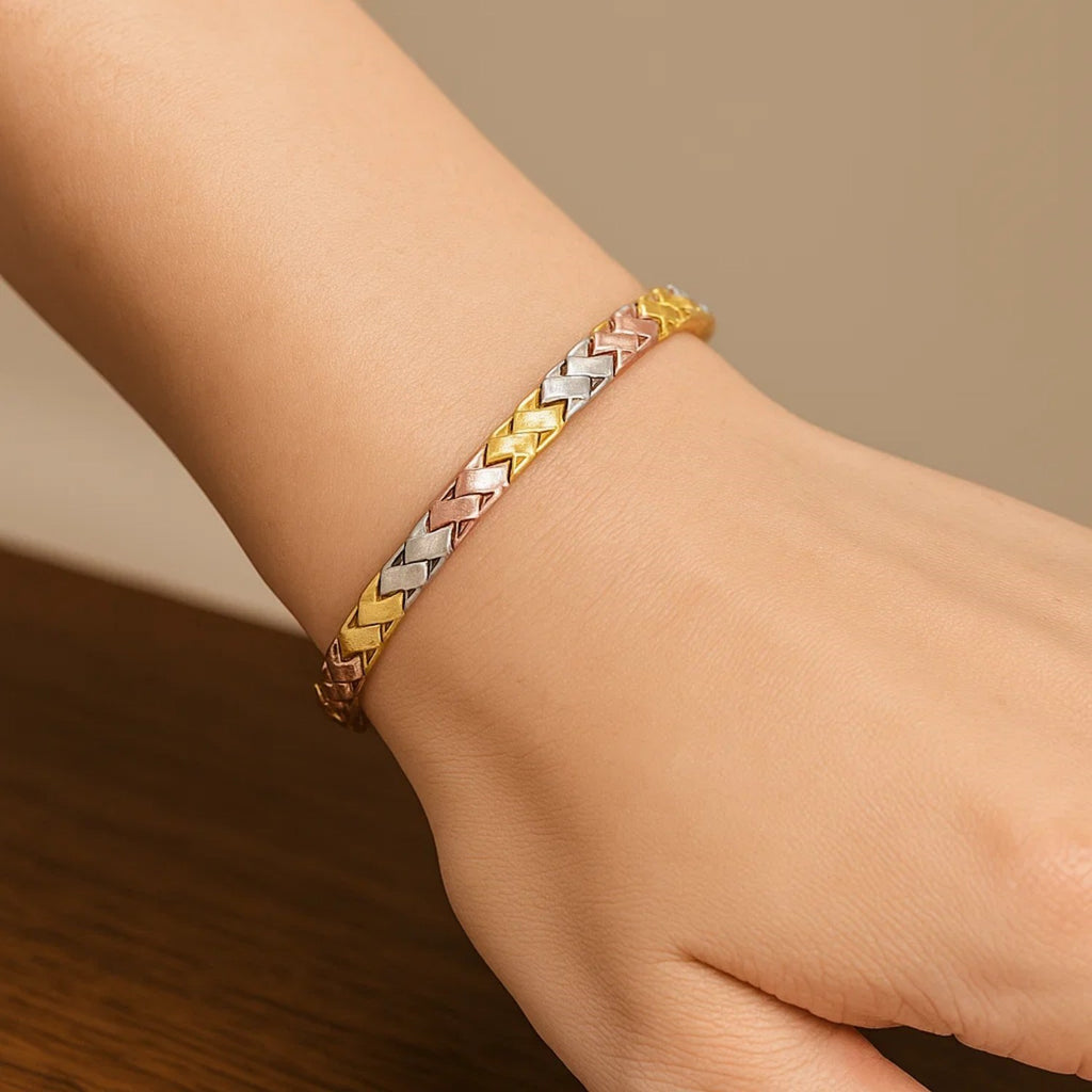 14k tri-color gold weave design bracelet showcasing elegant craftsmanship and luxurious style.