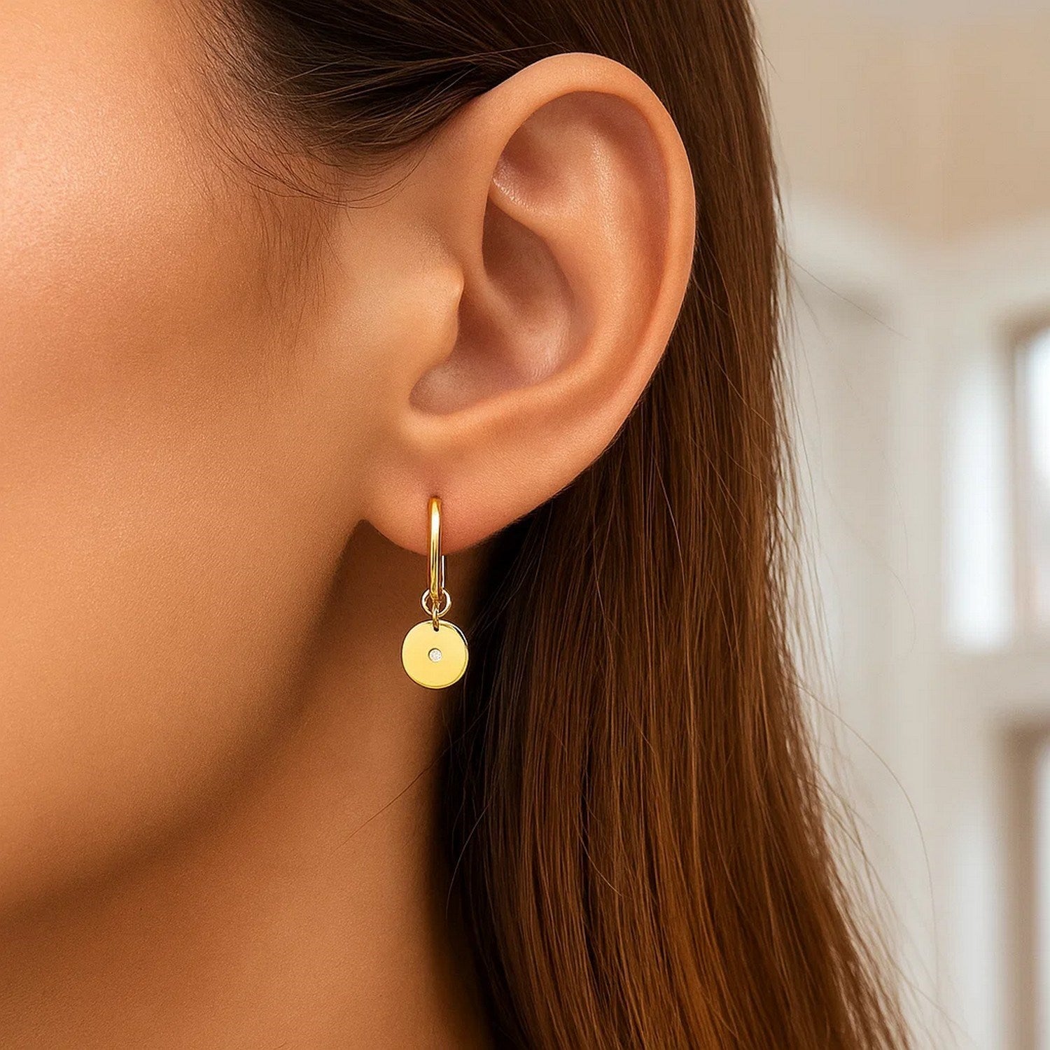 14K yellow gold hoop earrings featuring a modern diamond disc charm for a luxurious touch.