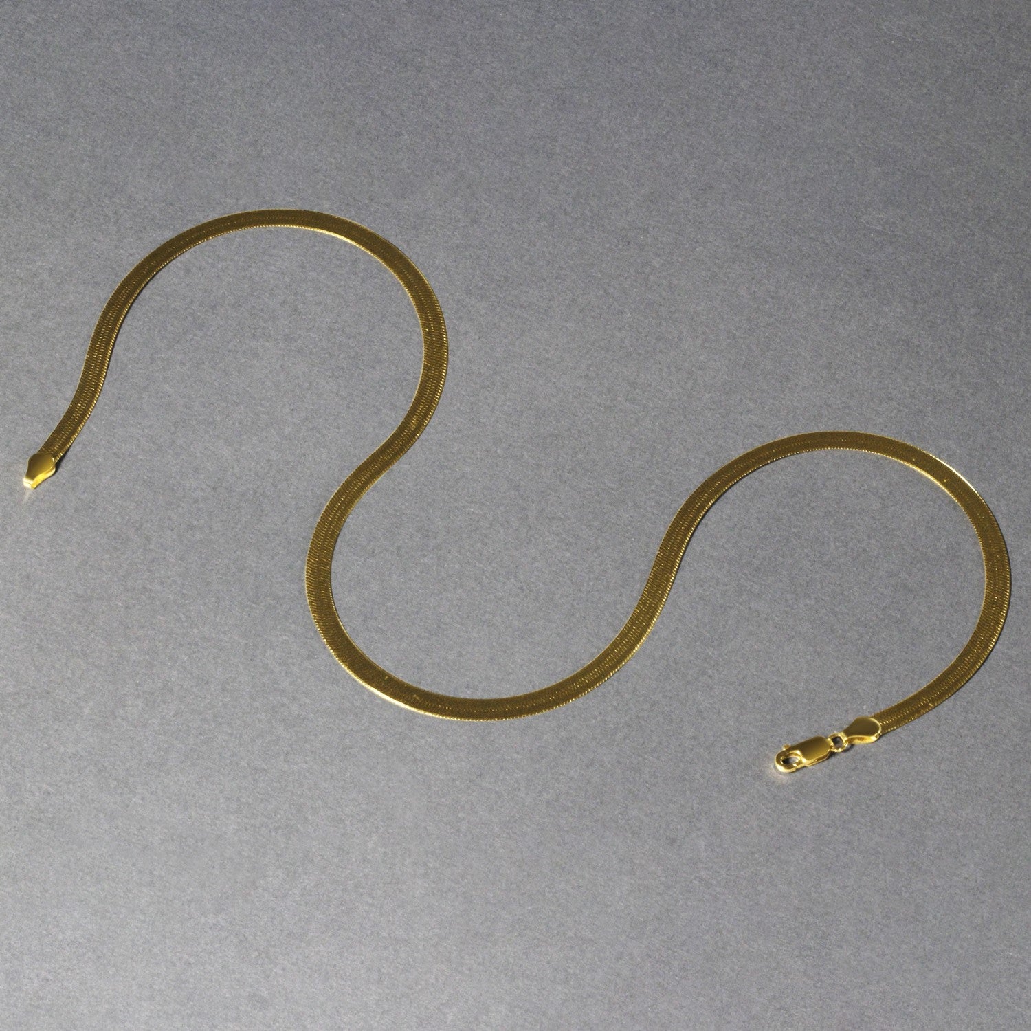 10k yellow gold Imperial Herringbone chain, minimalist design with elegant round links, perfect for layering or standalone...