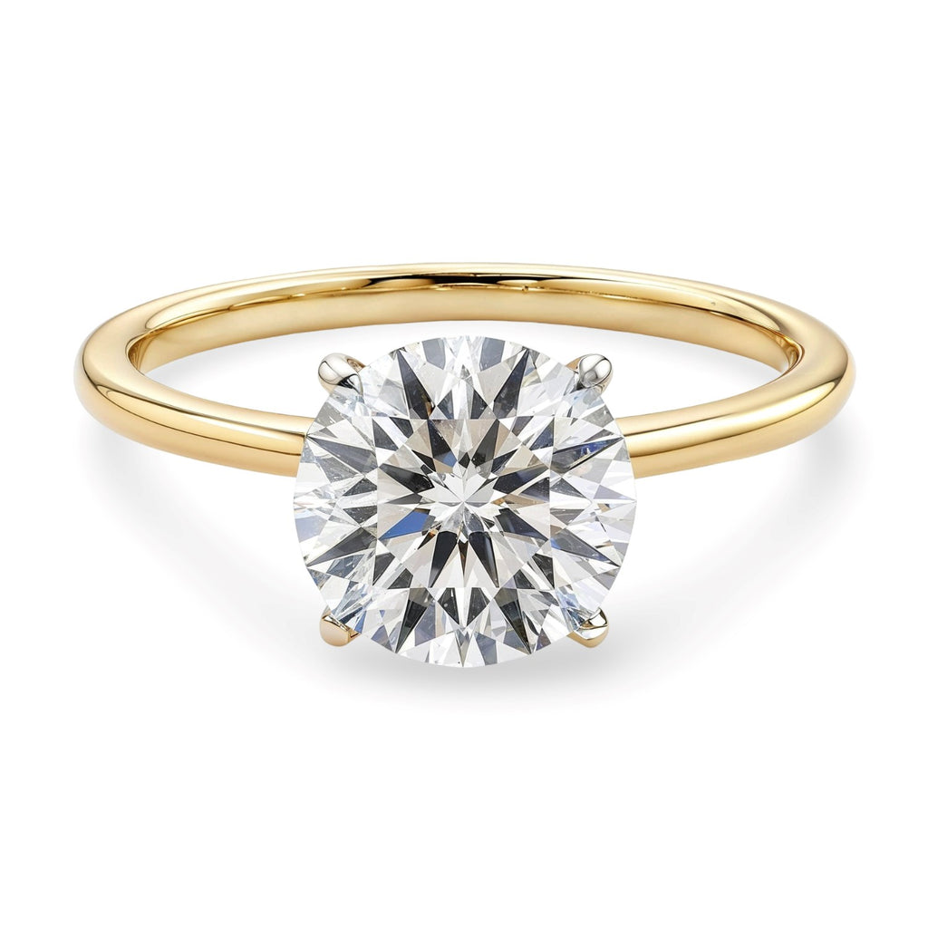 1 1/2 carat round lab-grown diamond solitaire ring in elegant 14k yellow gold setting, showcasing timeless luxury.
