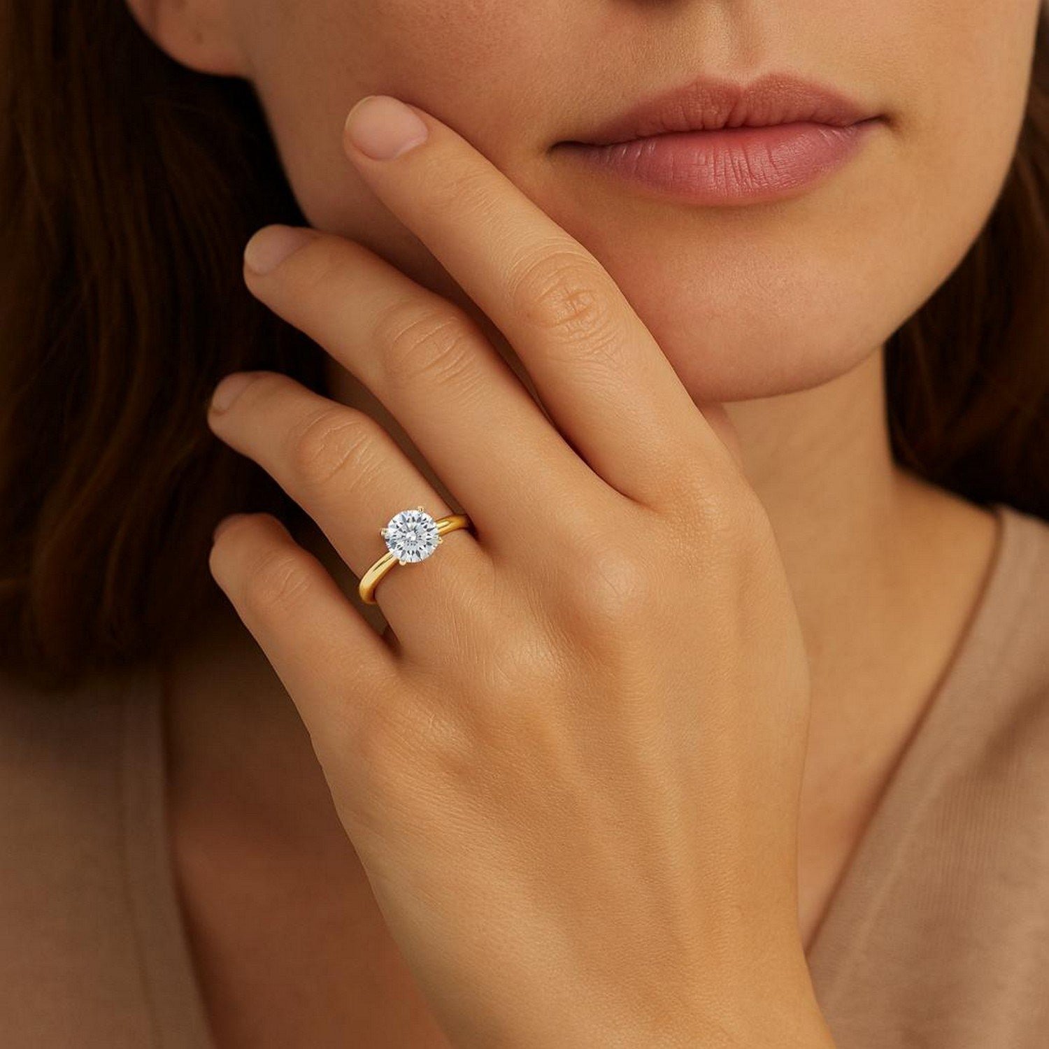 Elegant 14k yellow gold solitaire ring featuring a 1 1/2 carat round lab-grown diamond, showcasing timeless luxury.