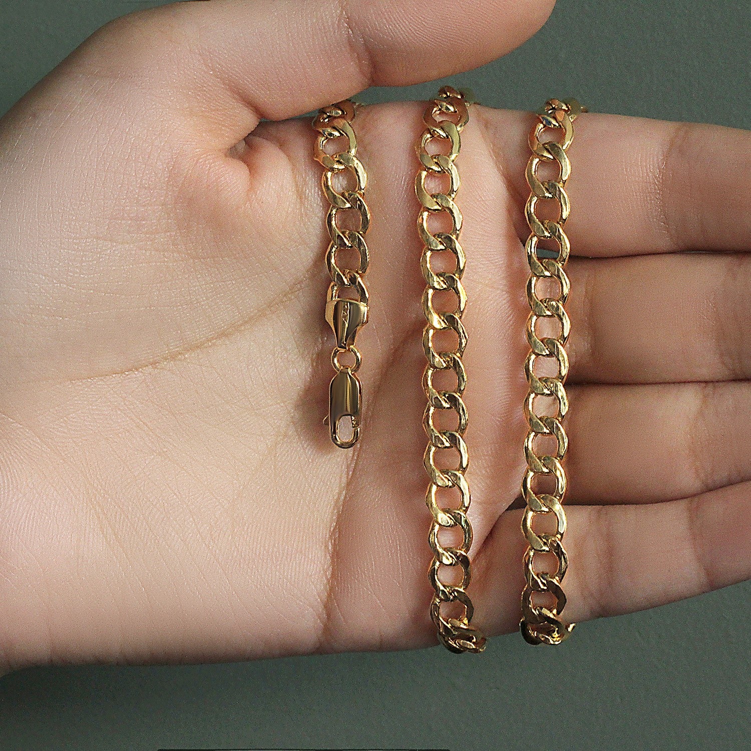 Elegant 10k yellow gold curb chain (6.20 mm) featuring smooth links, perfect for layering or standalone wear.