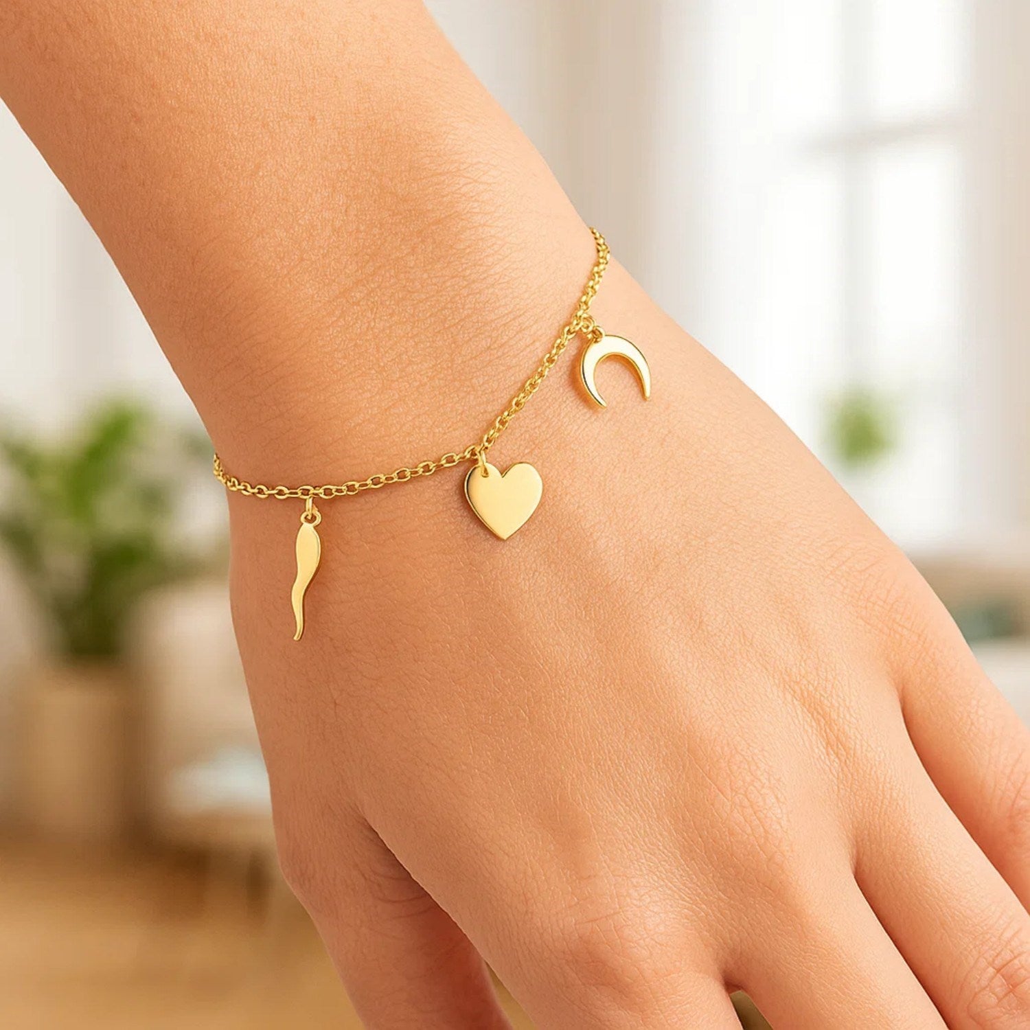 14k yellow gold 7-inch bracelet featuring polished charms in a modern chain design, perfect for elegant styling.