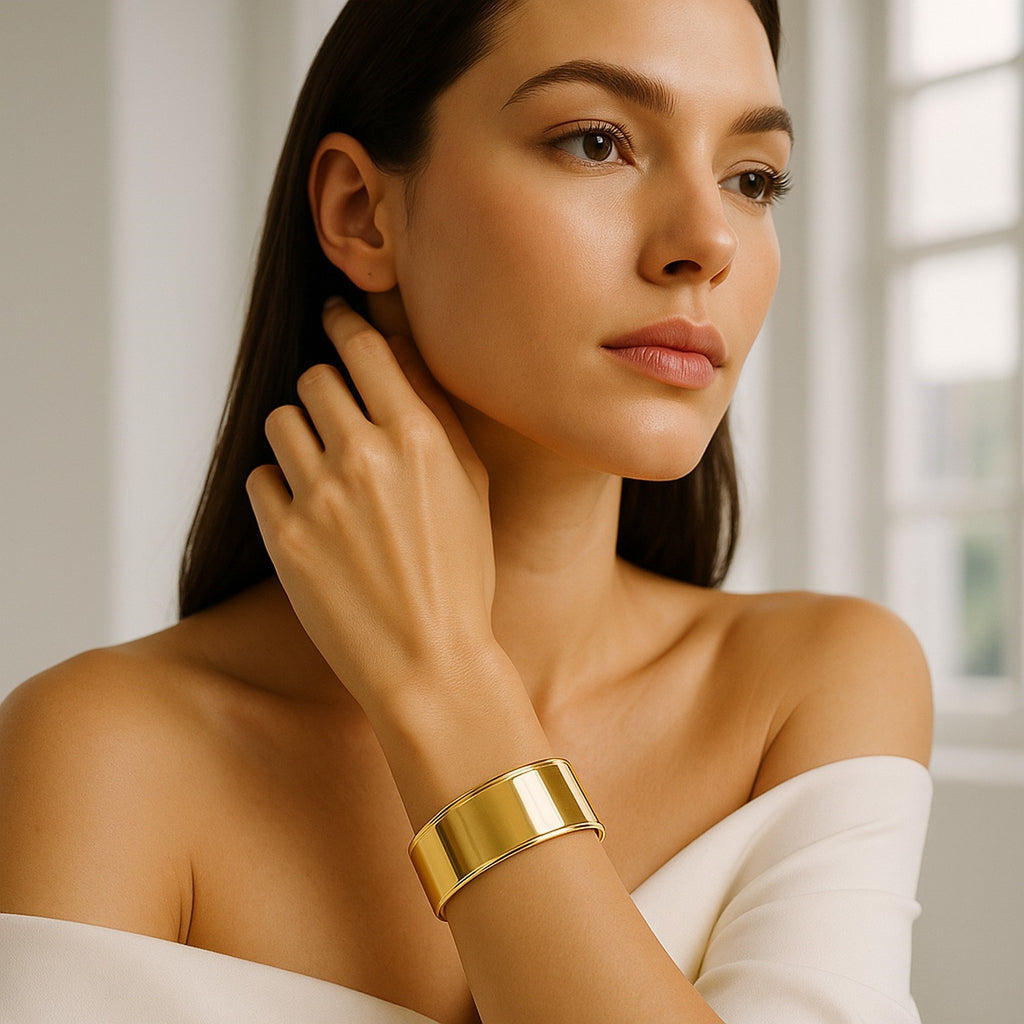 14k yellow gold designer cuff bangle featuring a sleek modern design and elegant stud accents.