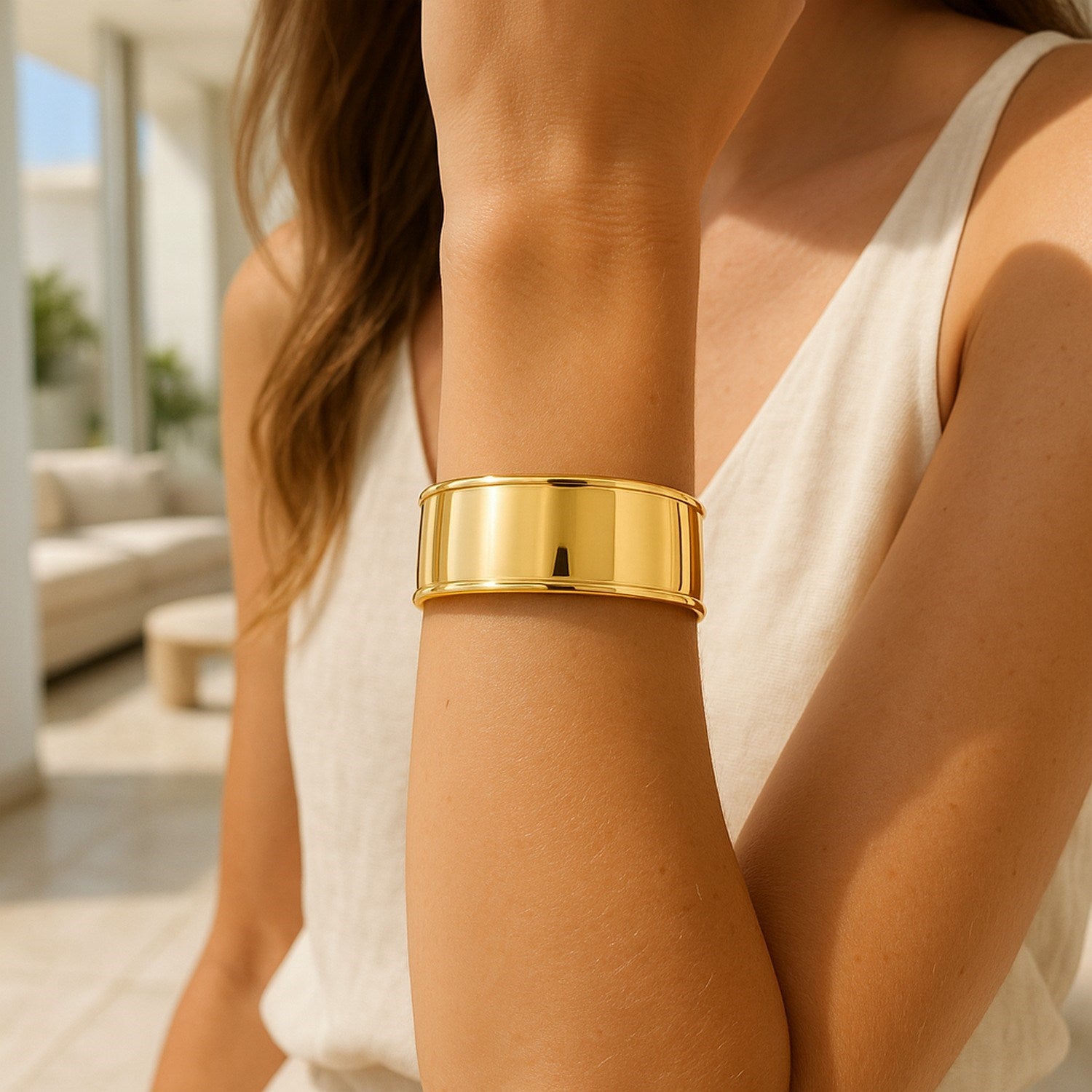 14k yellow gold designer classic cuff bangle featuring a modern stud design, showcasing elegance and sophistication.