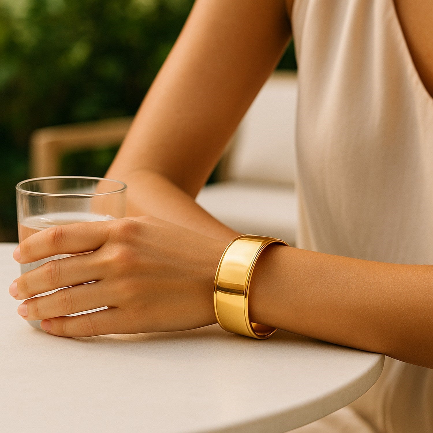 Modern 14k yellow gold cuff bangle featuring a sleek design and stud detail, perfect for luxury jewelry lovers.