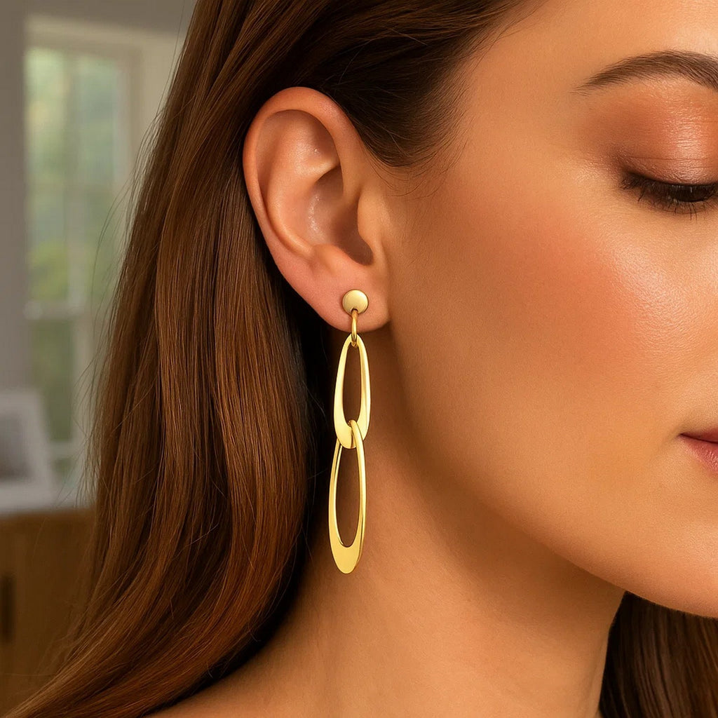 Elegant 14k yellow gold dangle link earrings featuring a refined oval design for a luxurious touch.