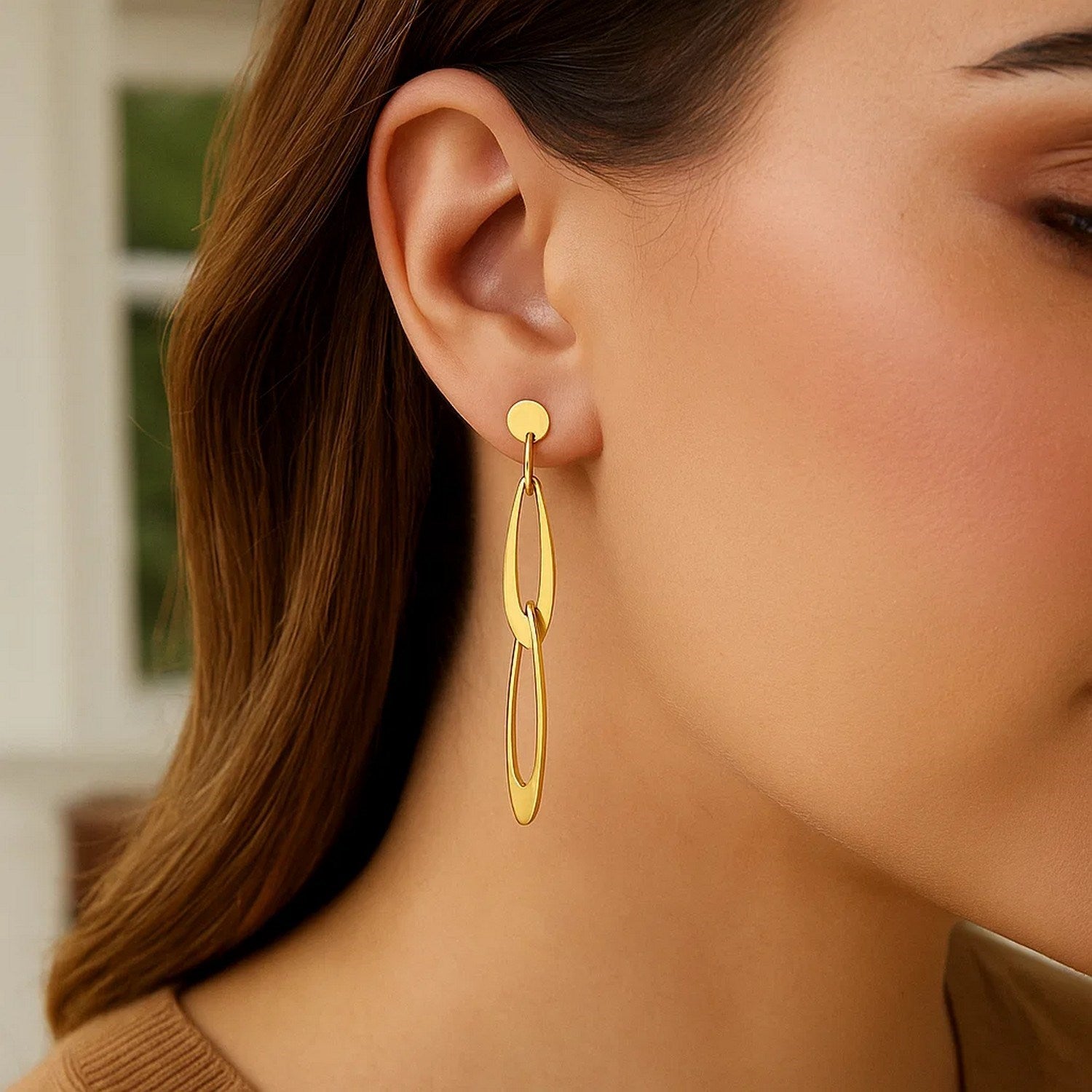 Elegant 14k yellow gold dangle link earrings featuring a refined oval design for a luxurious touch.