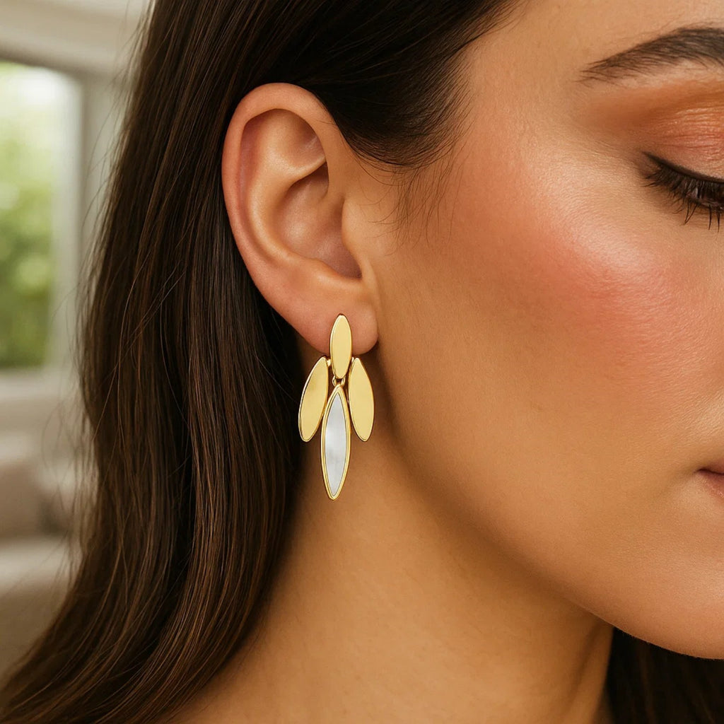 14k yellow gold modern dangle earrings featuring lustrous pearls for an elegant touch.