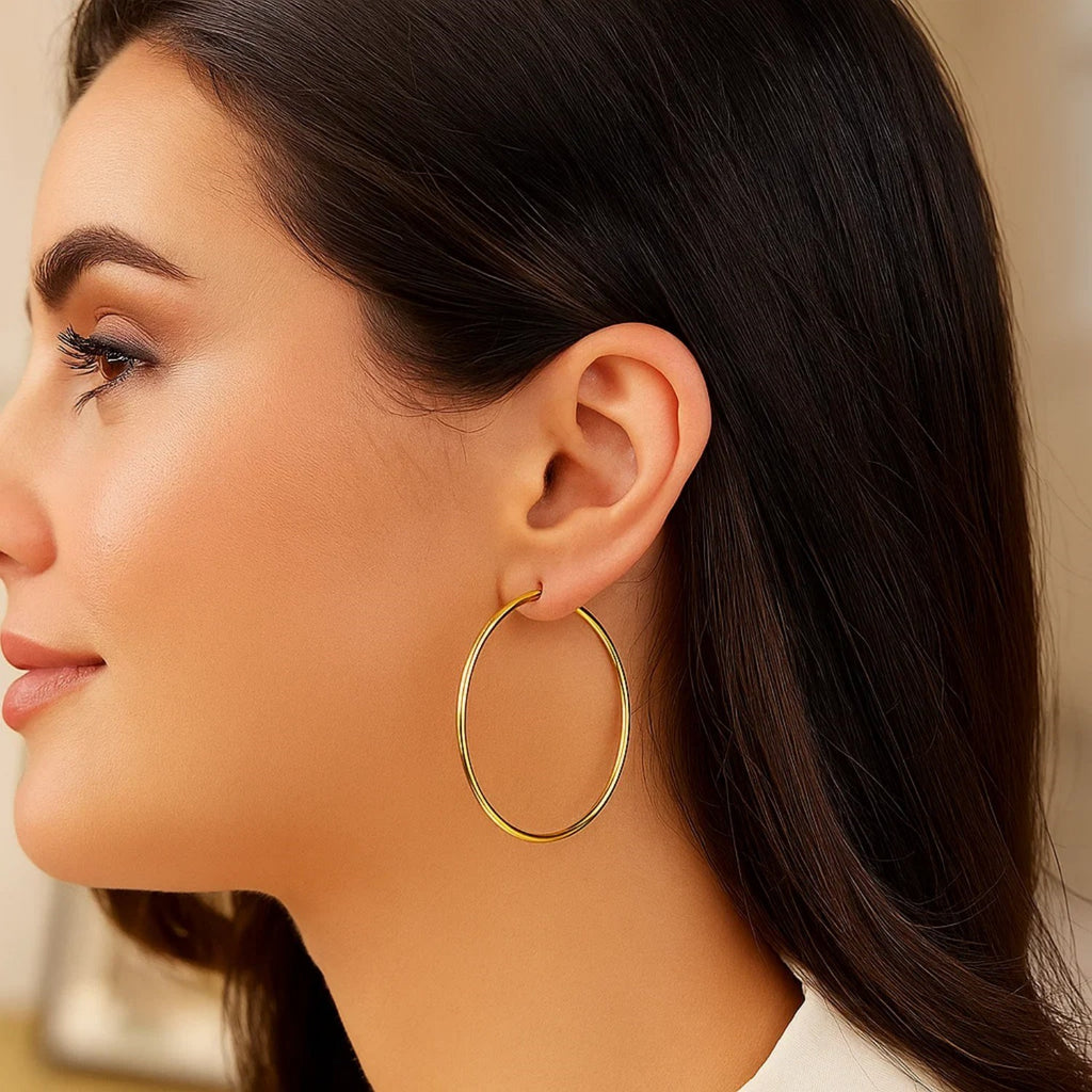 14k yellow gold polished hoop earrings, modern design, 45mm size, perfect for elegant everyday wear.