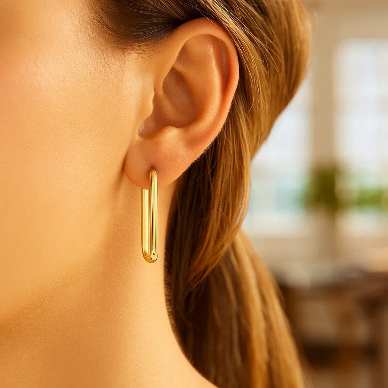 14k yellow gold modern endless rectangle hoop earrings showcasing sleek design and luxurious craftsmanship.