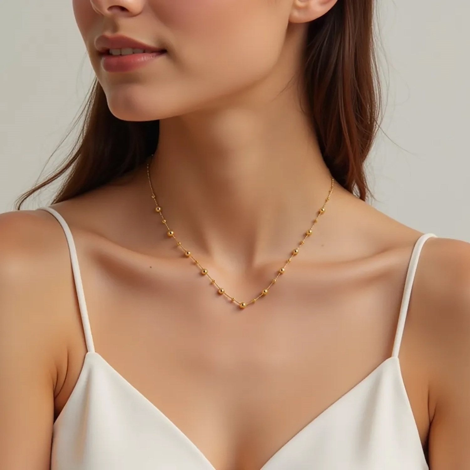 Elegant 14k yellow gold bead necklace showcasing luxurious craftsmanship and timeless design.