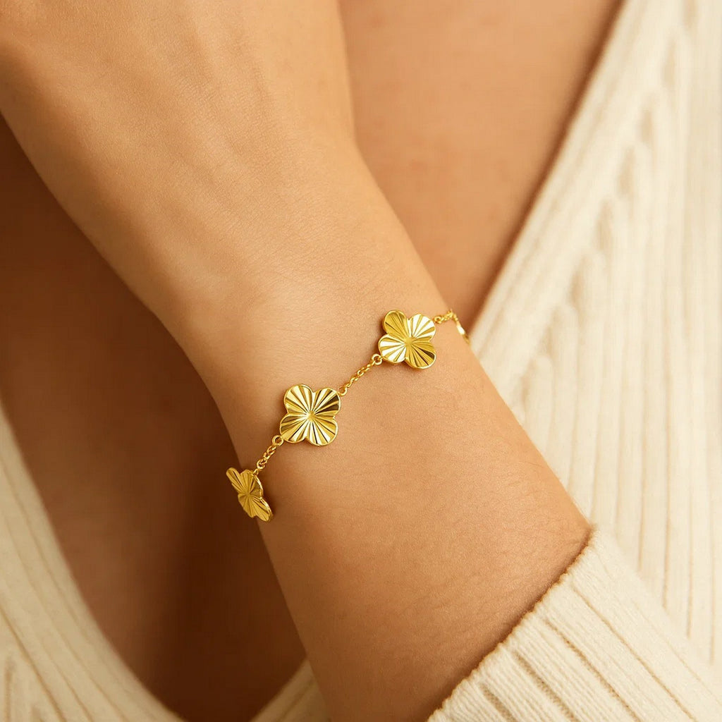 14K yellow gold contemporary clover bracelet featuring a luxurious design and elegant craftsmanship.