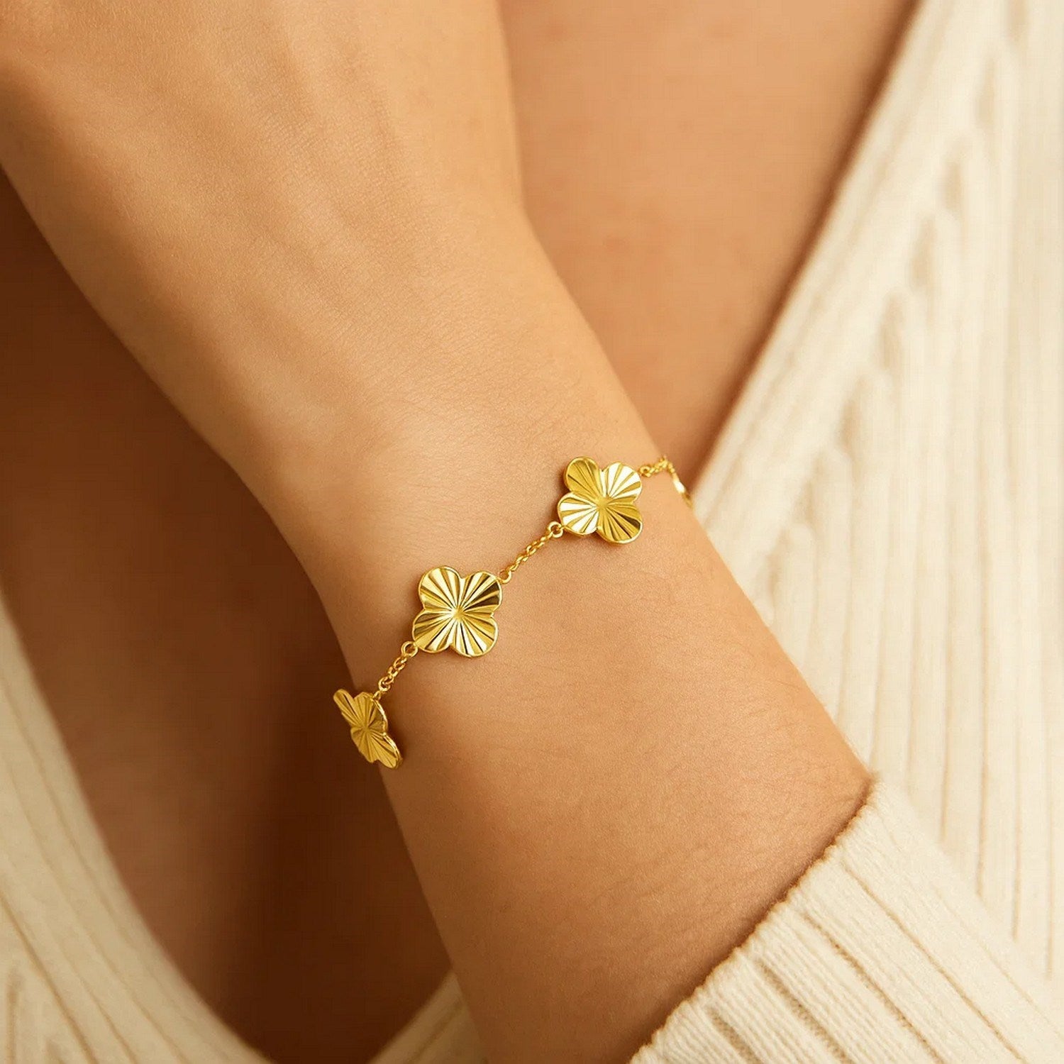 14K yellow gold contemporary clover bracelet featuring a luxurious design and elegant craftsmanship.