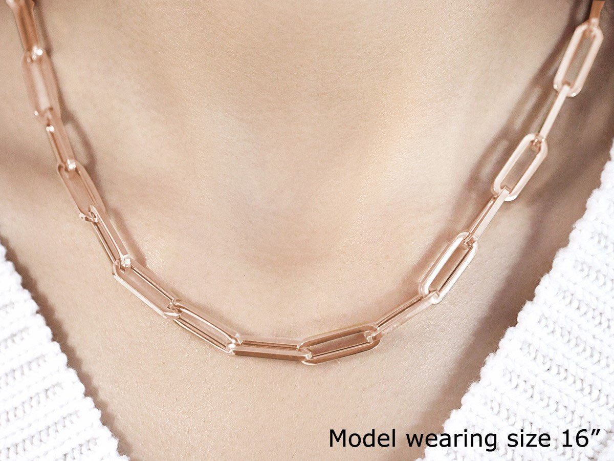 14K rose gold wide paperclip chain featuring modern links, perfect for layering or wearing solo.