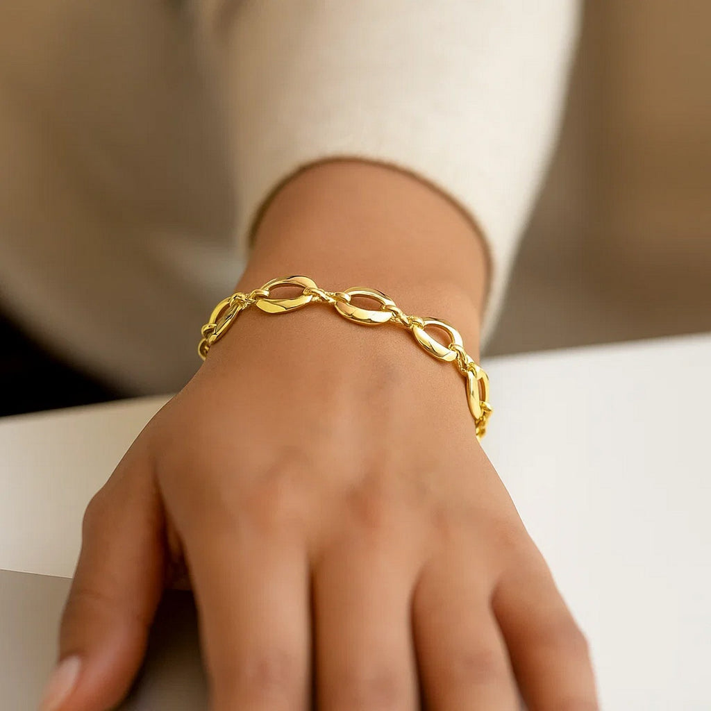 14k yellow gold contemporary infinity link bracelet, elegantly crafted with a polished finish for timeless luxury.