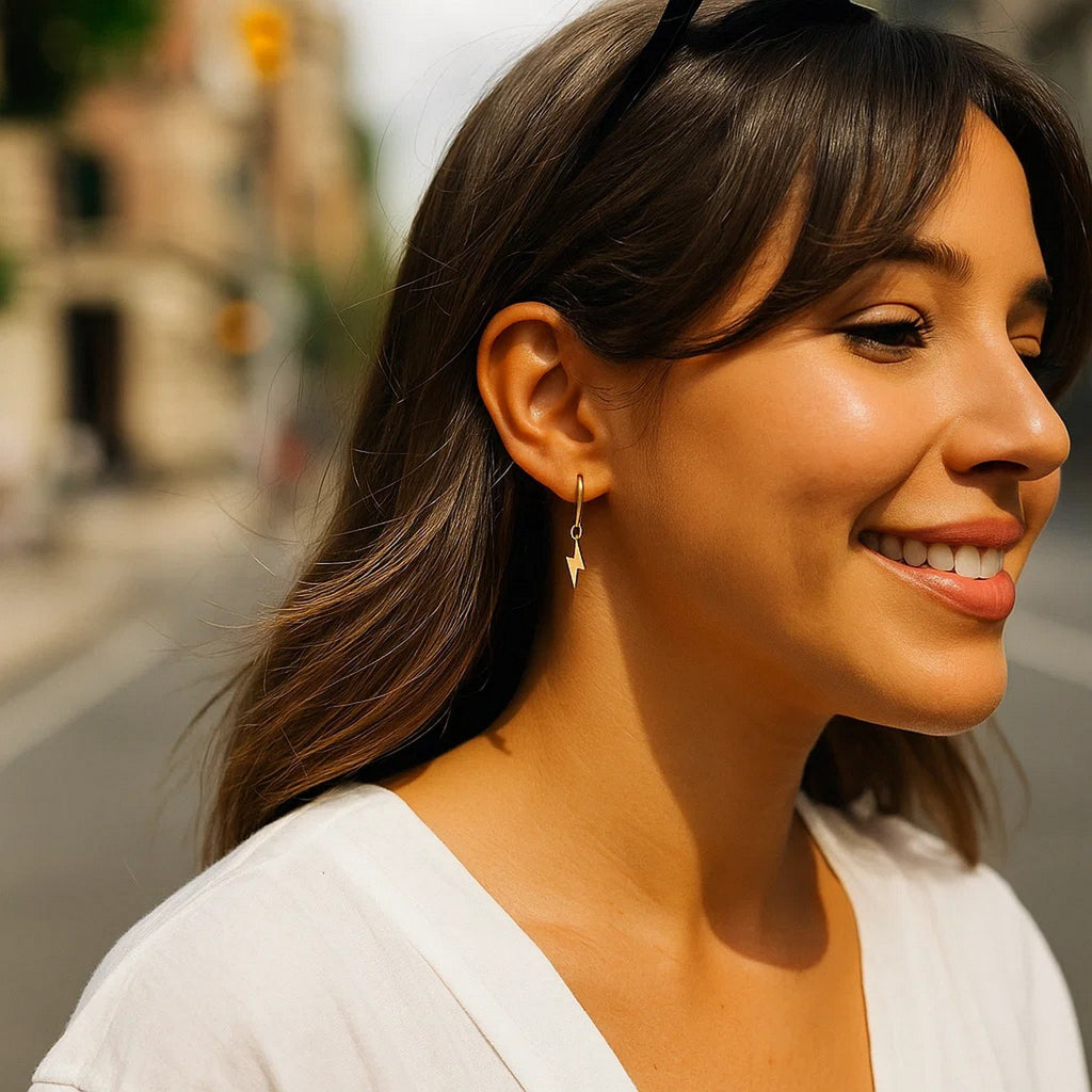 14K yellow gold lightning bolt drop hoop earrings with modern design, perfect for adding a touch of elegance.