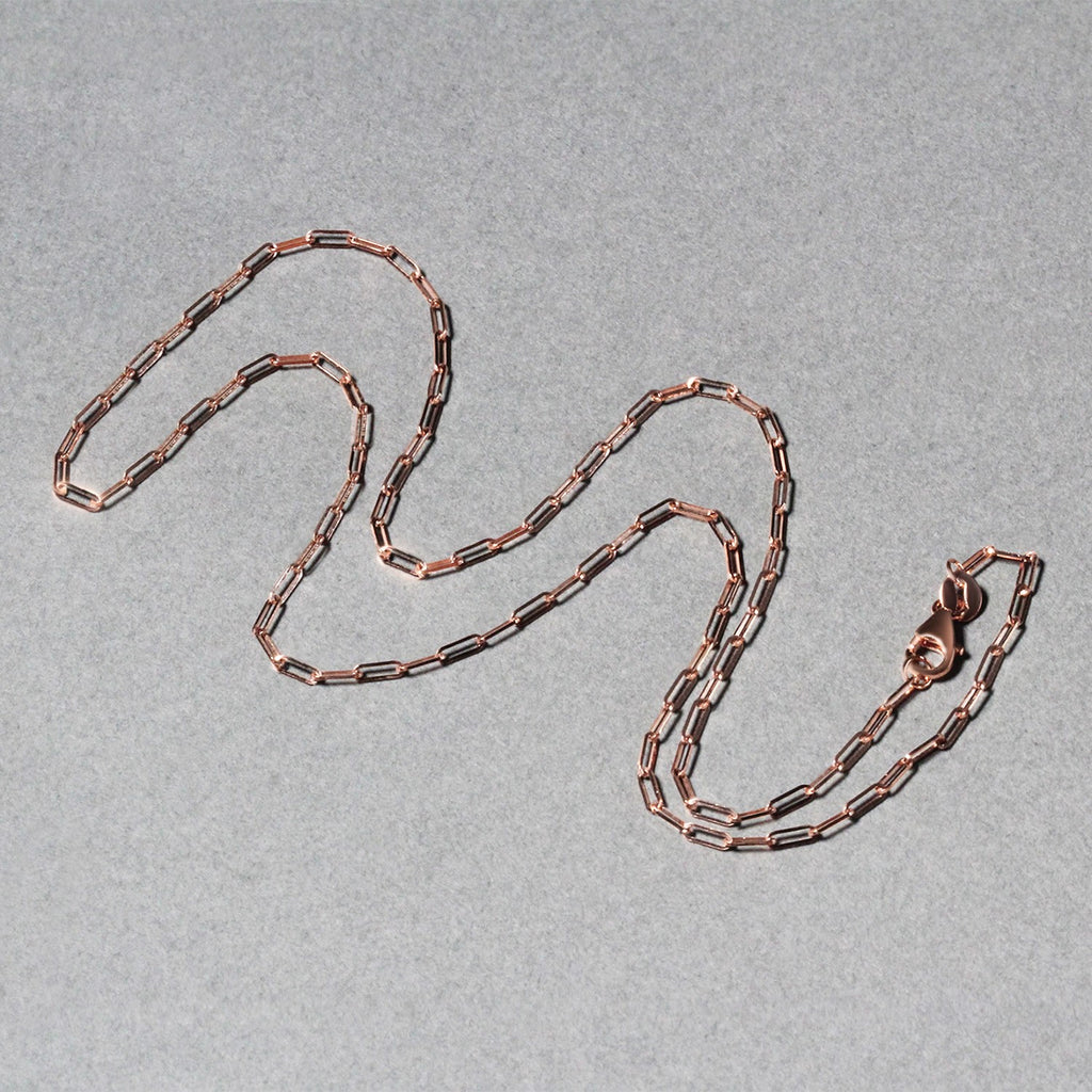 14k rose gold fine paperclip chain with modern links, perfect for layering or as a statement piece.