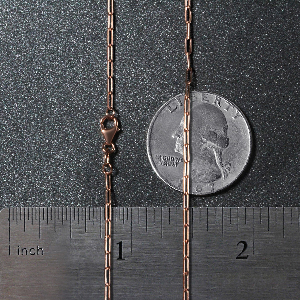 14K rose gold fine paperclip chain featuring modern links, perfect for layering or as a statement piece.