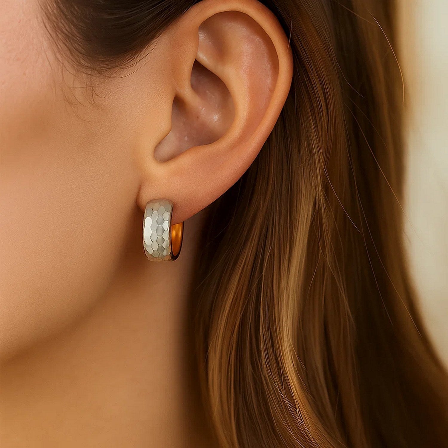 14k two-tone gold diamond cut interlaced hoop earrings showcasing a classic design with exquisite craftsmanship.