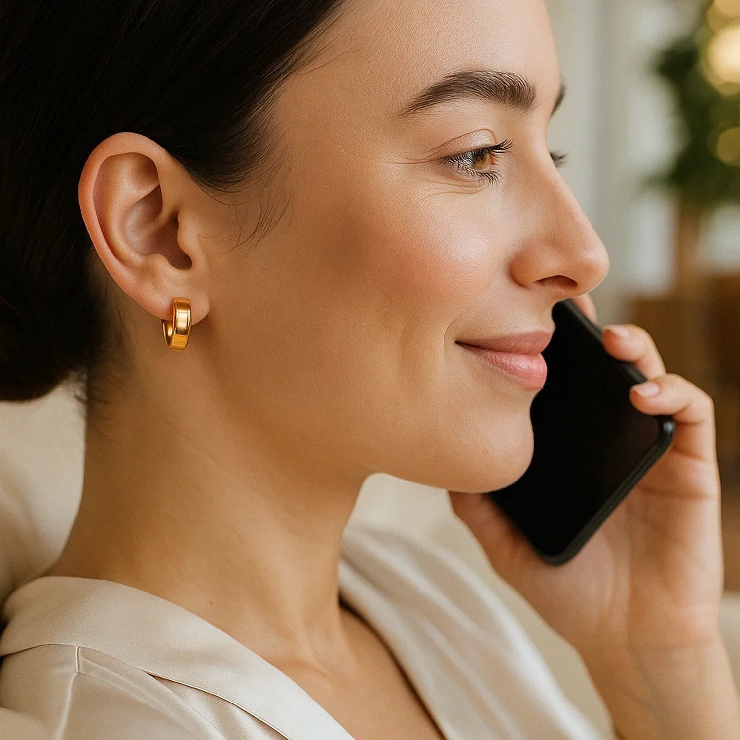 14k yellow gold polished tube hoop earrings with a sleek modern design, perfect for elegant everyday wear.