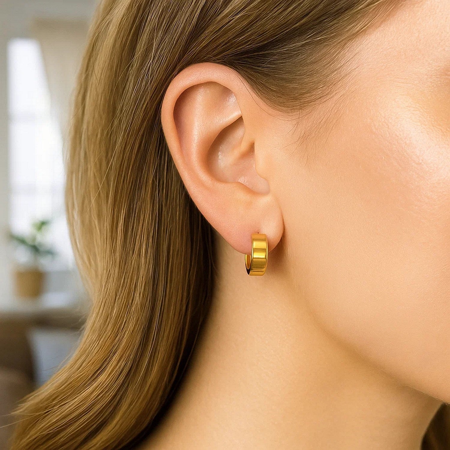 14K yellow gold polished tube hoop earrings with a sleek modern design, perfect for elegant occasions.