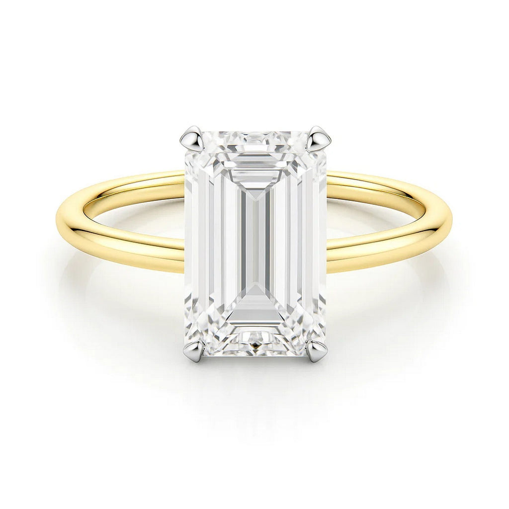 14k yellow gold solitaire ring featuring a 3 carat emerald and IGI G/VS1 diamond, showcasing modern elegance.