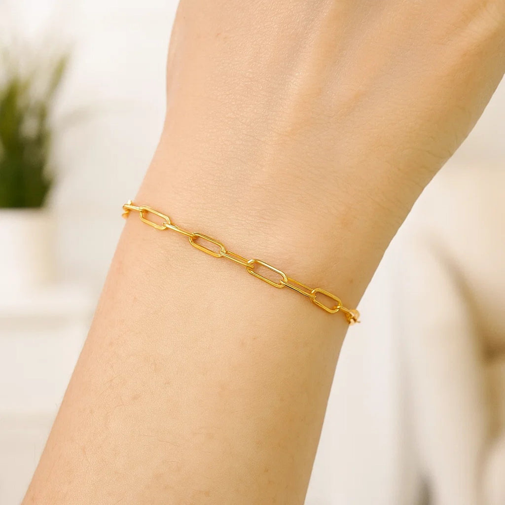 14k yellow gold paperclip bracelet with modern link design, showcasing elegance and timeless luxury.