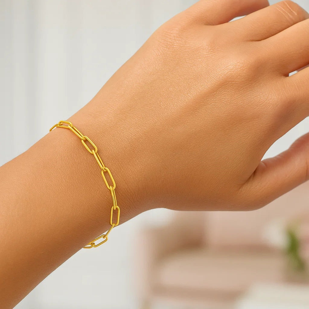 14k yellow gold modern paperclip bracelet featuring elegant links, perfect for layering or wearing solo.