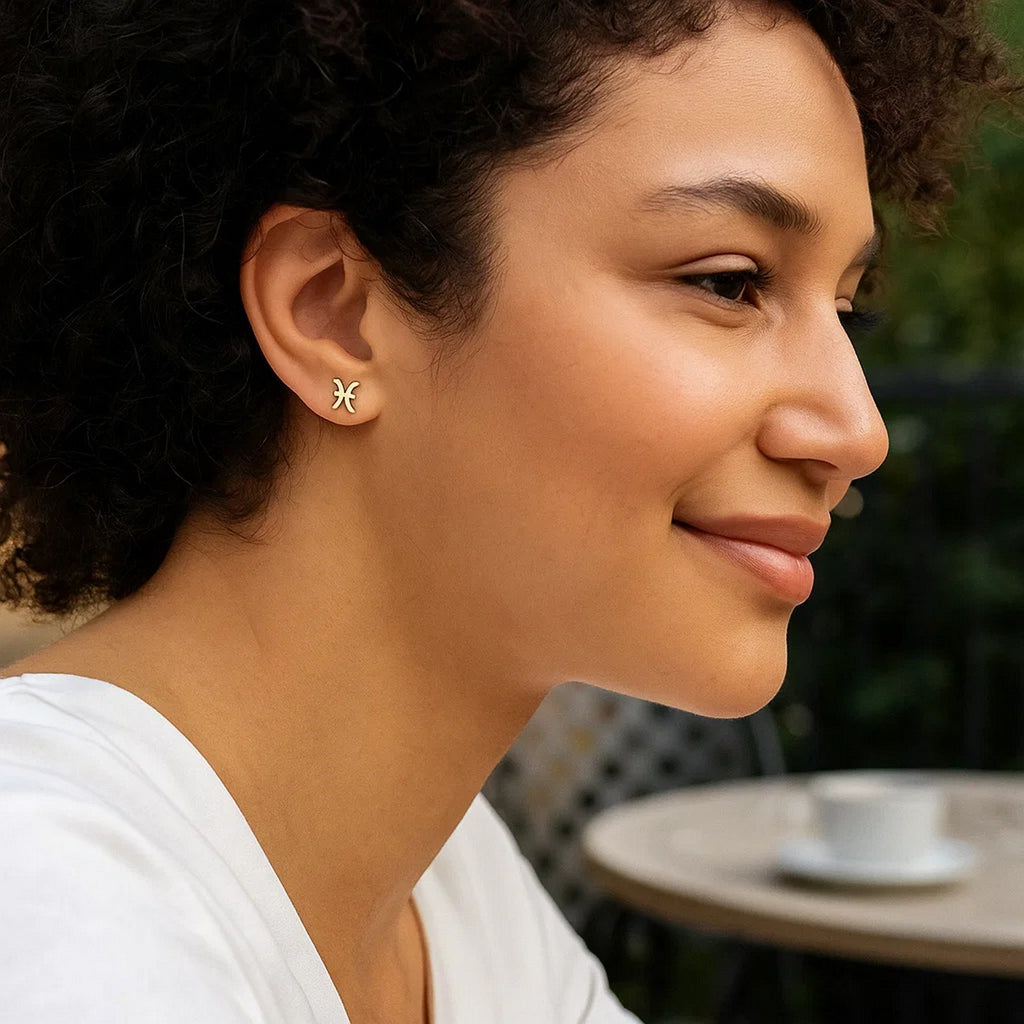 14k yellow gold modern Pisces stud earrings featuring a sleek design and polished finish for elegant sophistication.