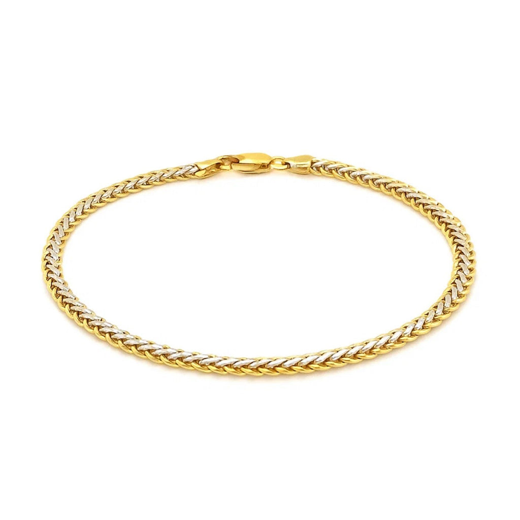 Elegant two-toned fine wheat chain bracelet in 10k yellow and white gold, featuring a luxurious link design.
