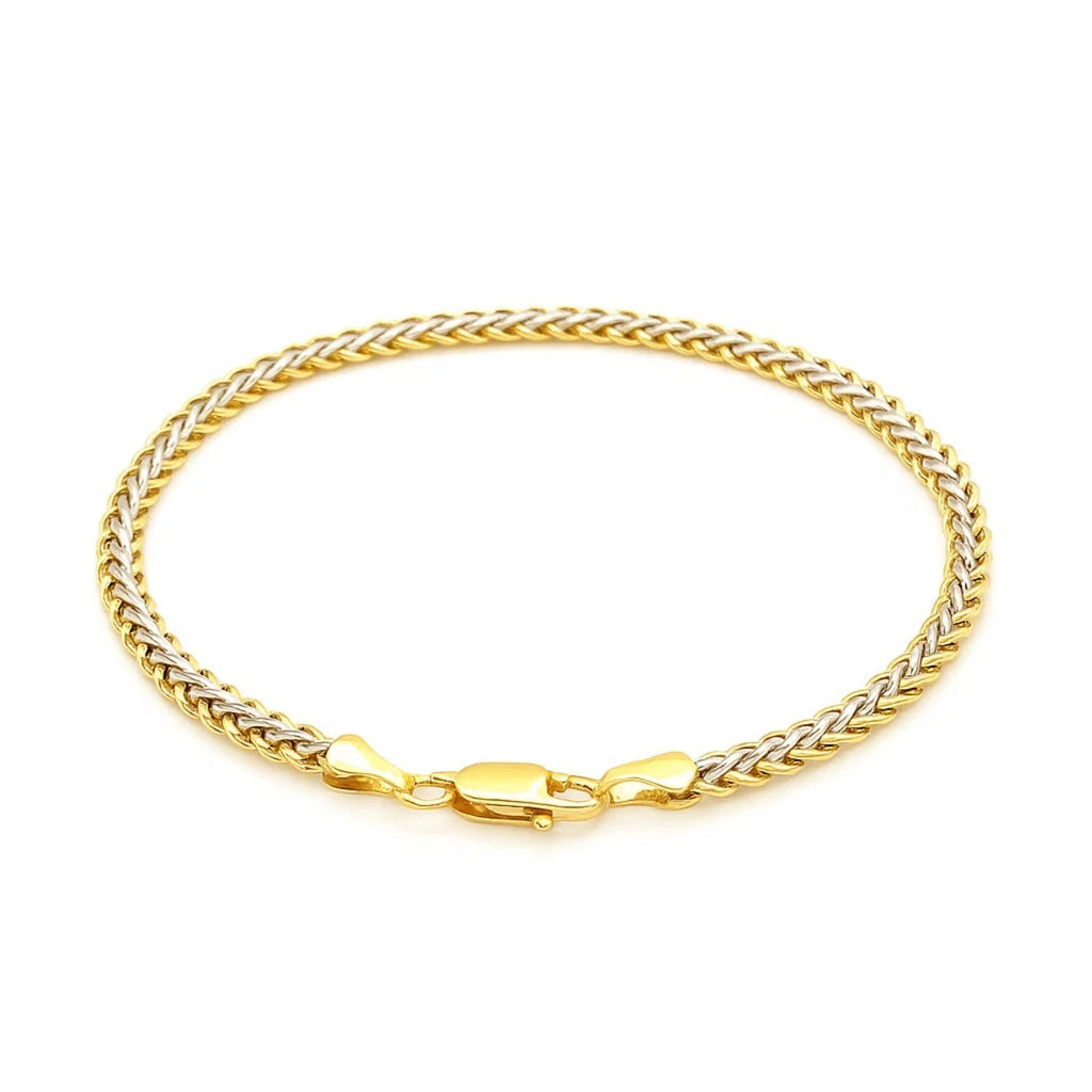 Elegant two-toned fine wheat chain bracelet in 10k yellow and white gold, featuring a luxurious link design.
