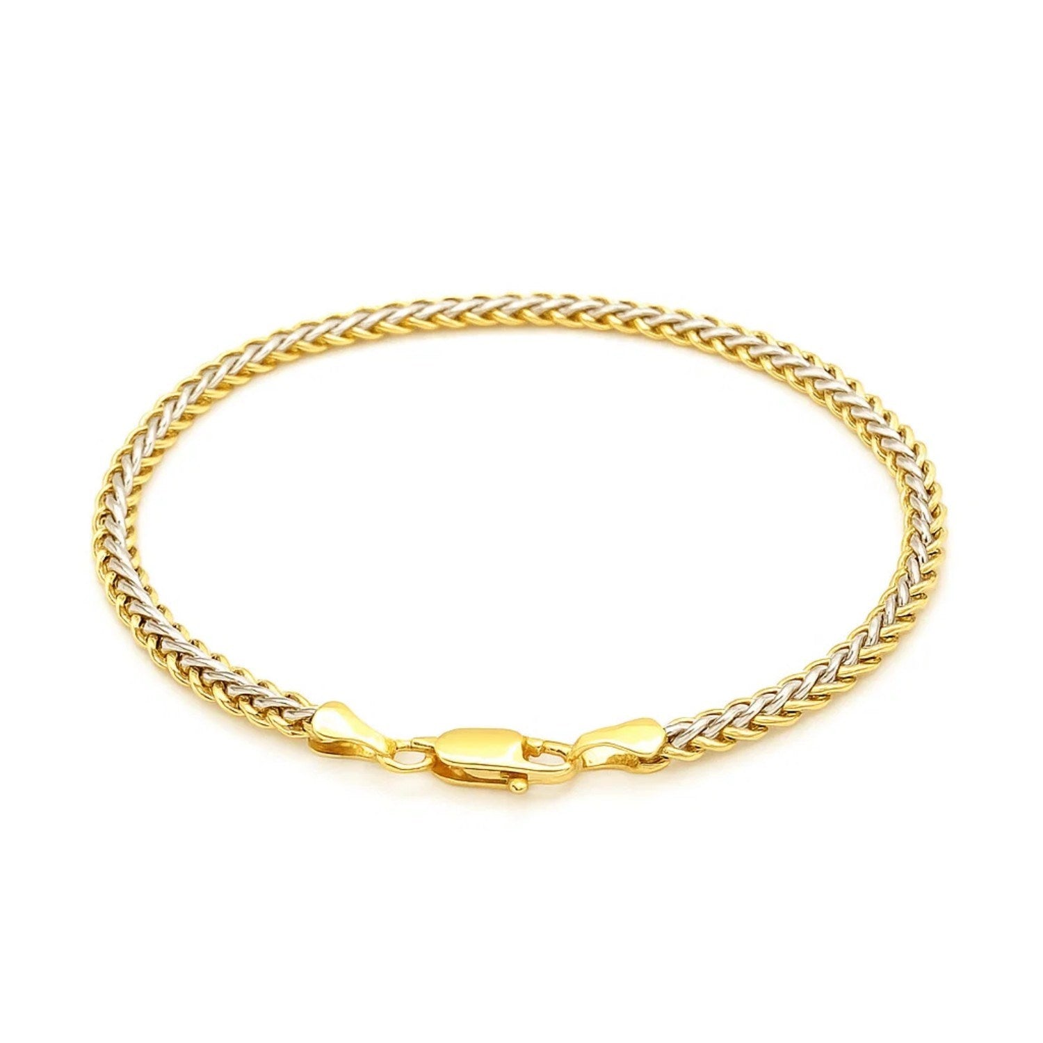 Elegant two-toned fine wheat chain bracelet in 10k yellow and white gold, featuring a luxurious link design.