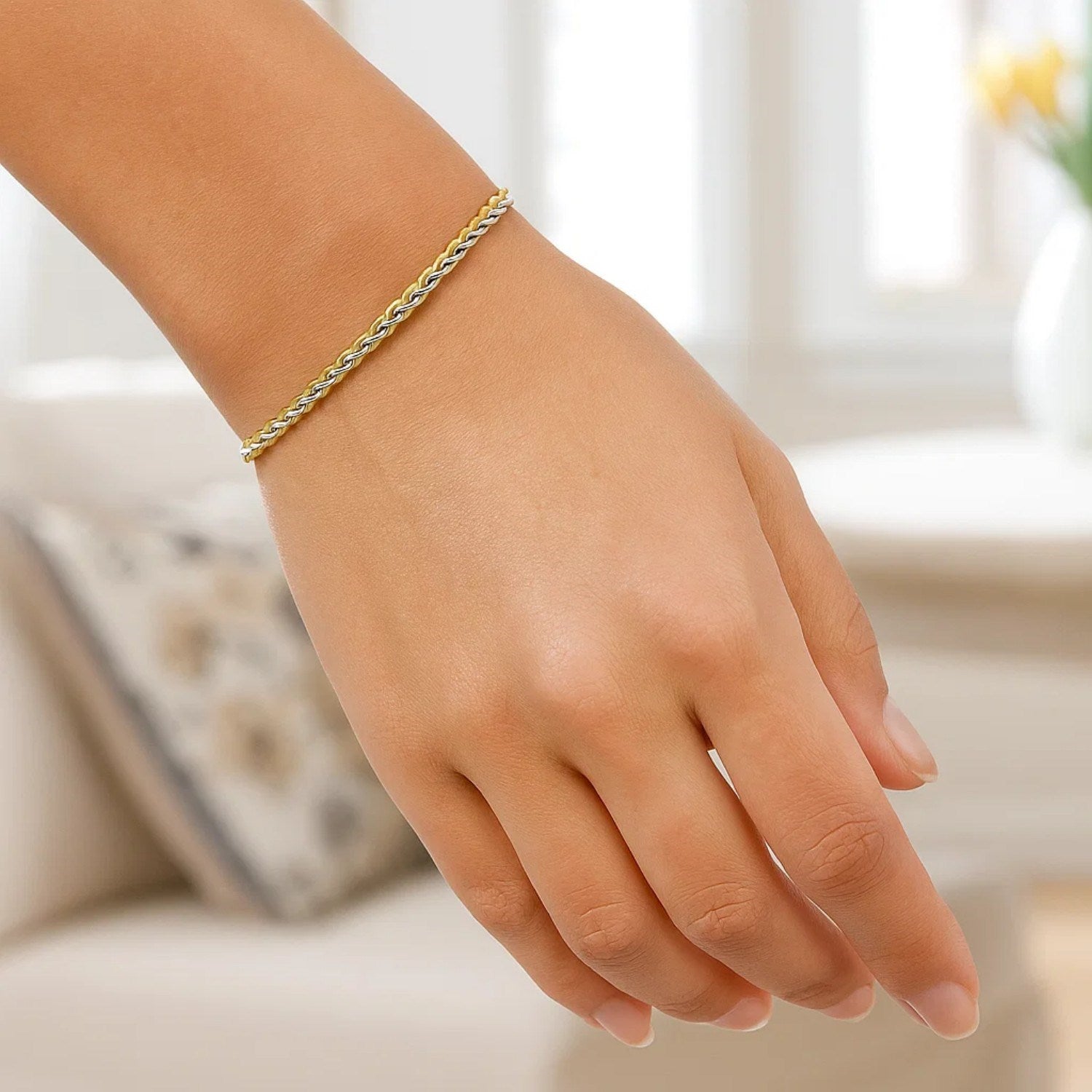 Elegant two-toned 10k yellow and white gold wheat chain bracelet, crafted in 14k gold with refined link design.