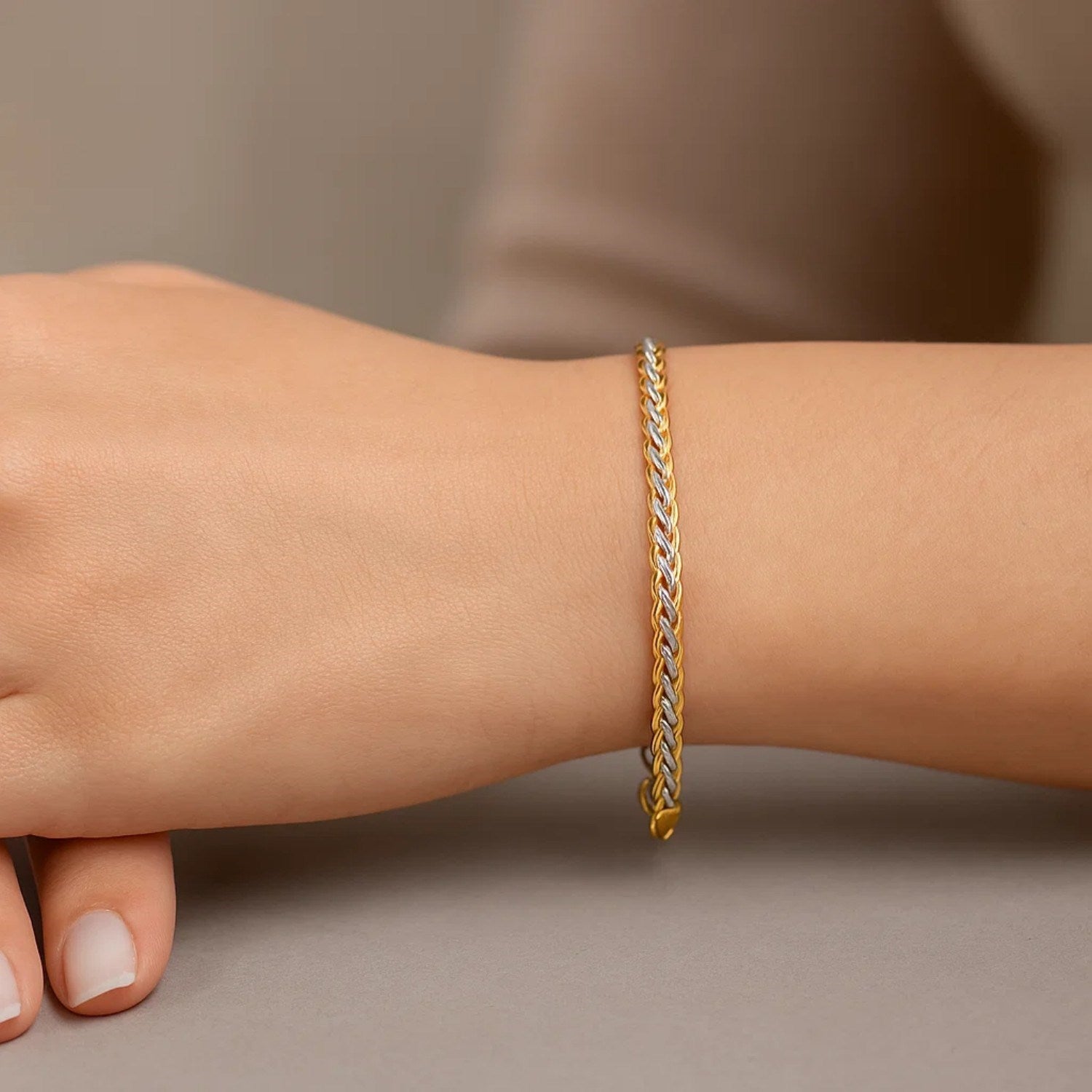 Two-toned 10k yellow and white gold wheat chain bracelet, elegant design with interlocking links, 3.00 mm width.