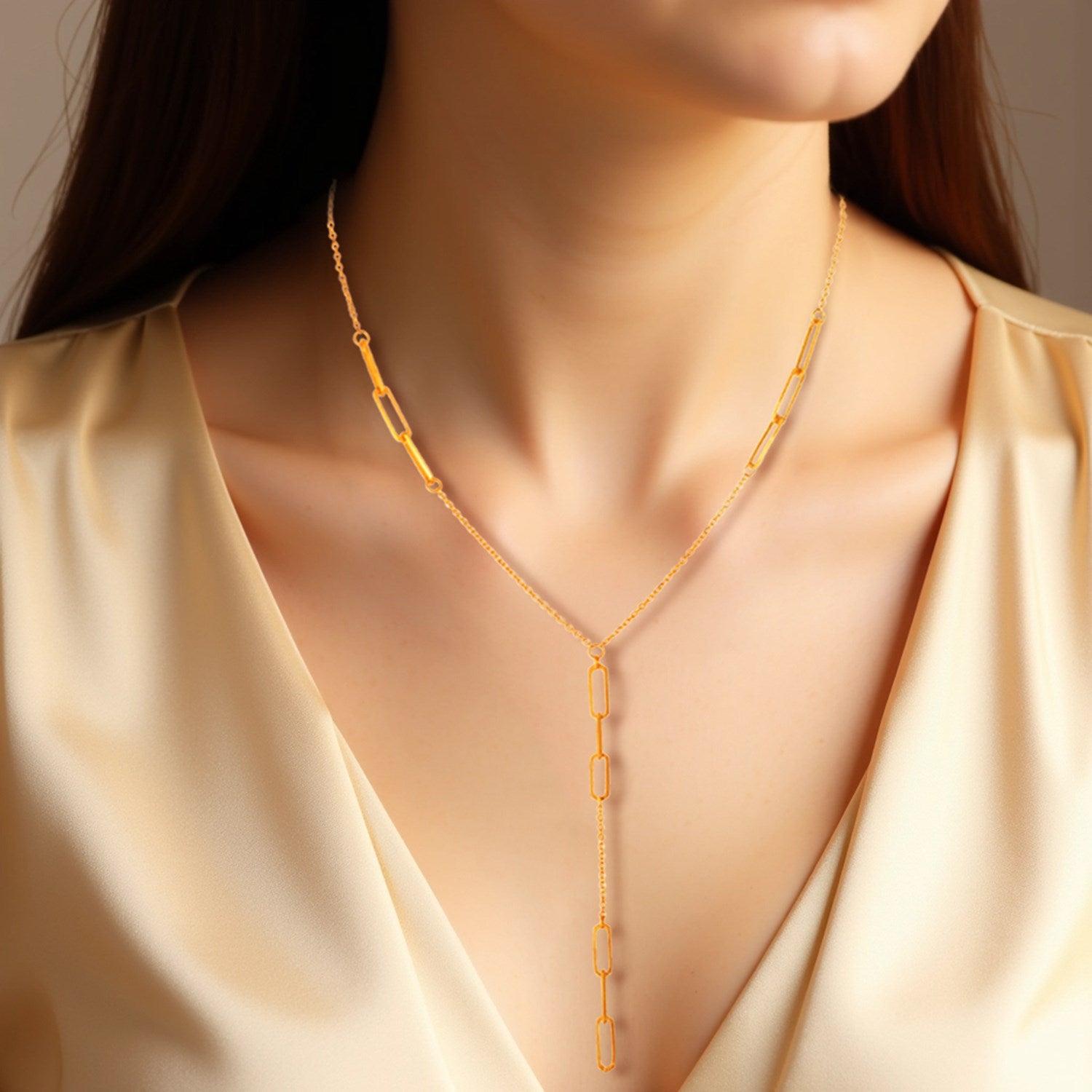 14K yellow gold lariat necklace featuring diamond accents and modern paperclip chain design, perfect for elegant layering.