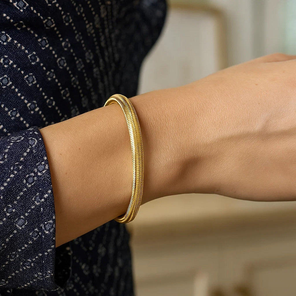 14k yellow gold medium stretch mesh bracelet featuring contemporary design and elegant stud accents.