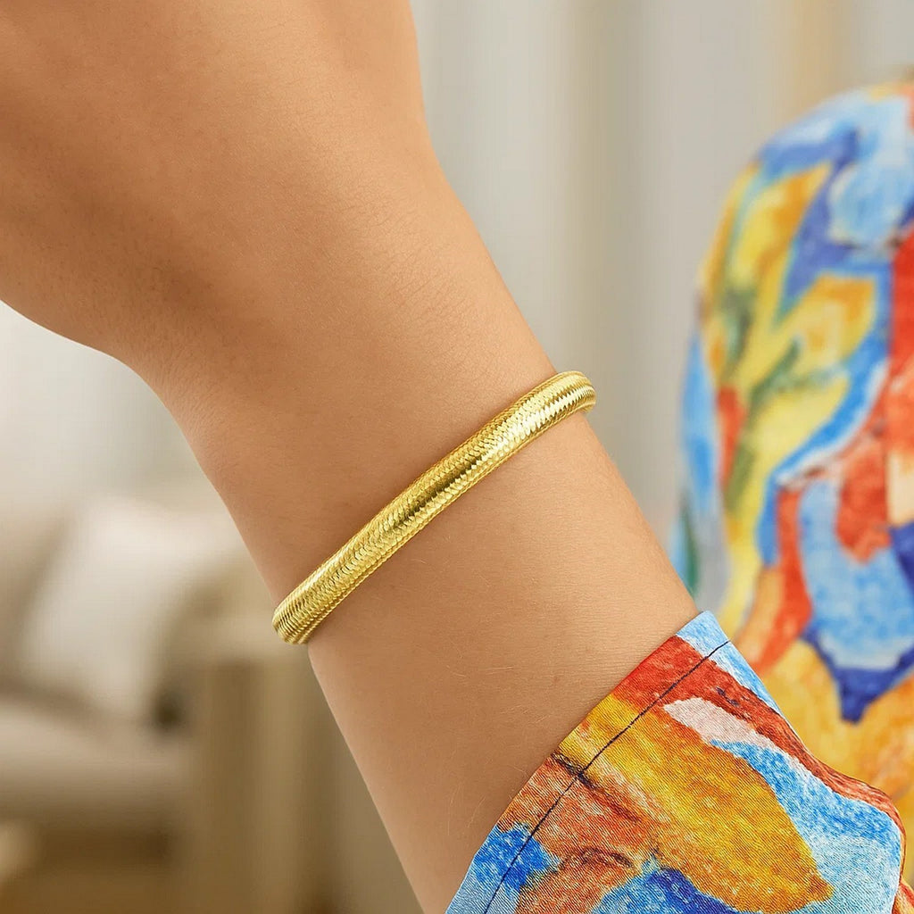 14K yellow gold medium stretch mesh bracelet featuring a contemporary design and elegant stud accents.