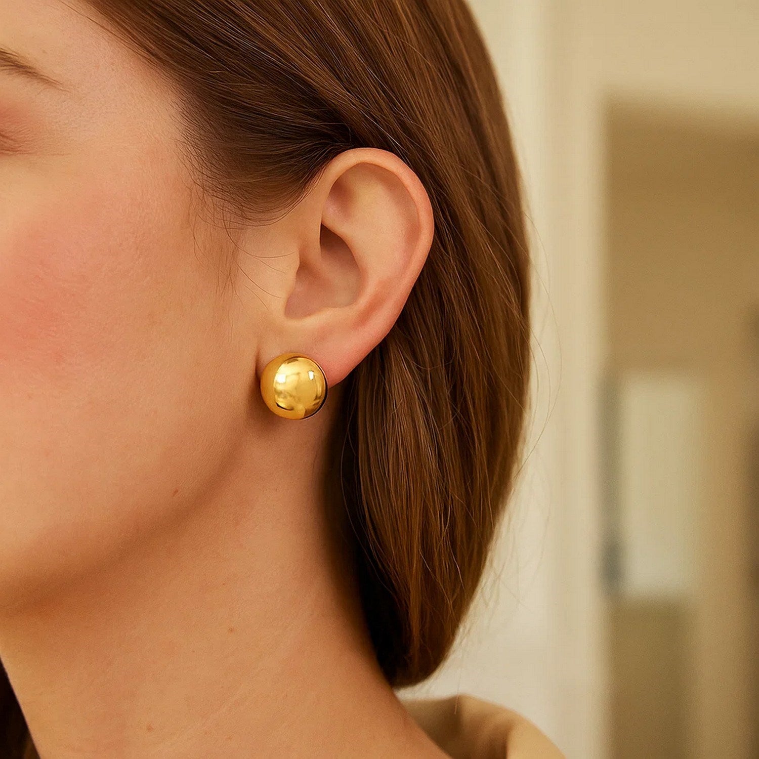 14K yellow gold puffed up button stud earrings with a modern design, perfect for elegant everyday wear.