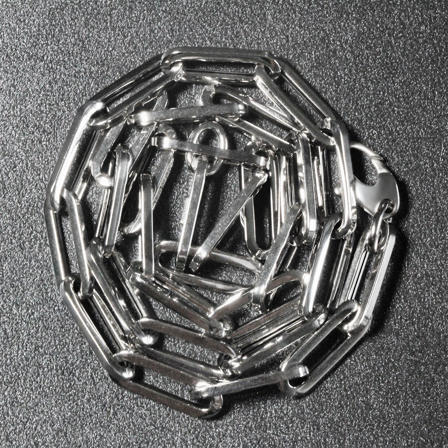 14K white gold wide paperclip chain, modern design with sleek round links, perfect for layering or standalone elegance.