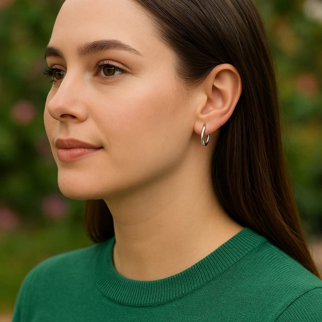14k white gold polished round hoop earrings with a sleek modern design, perfect for elegant everyday wear.