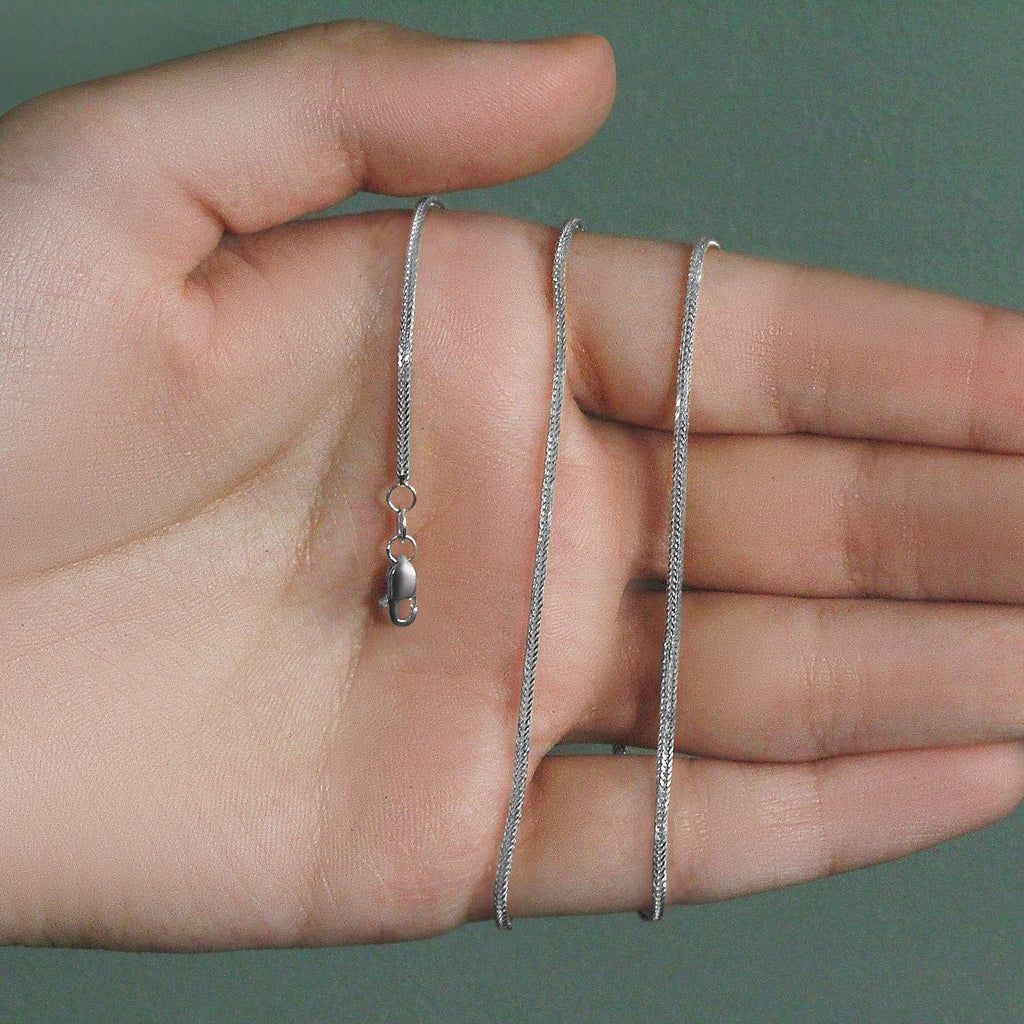 Elegant 14k white gold foxtail chain, 1.00 mm, showcasing a refined round design for timeless luxury.