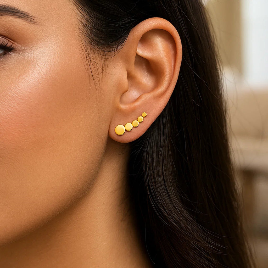 14k yellow gold graduated circles climber earrings with a modern design, perfect for adding elegance to any outfit.