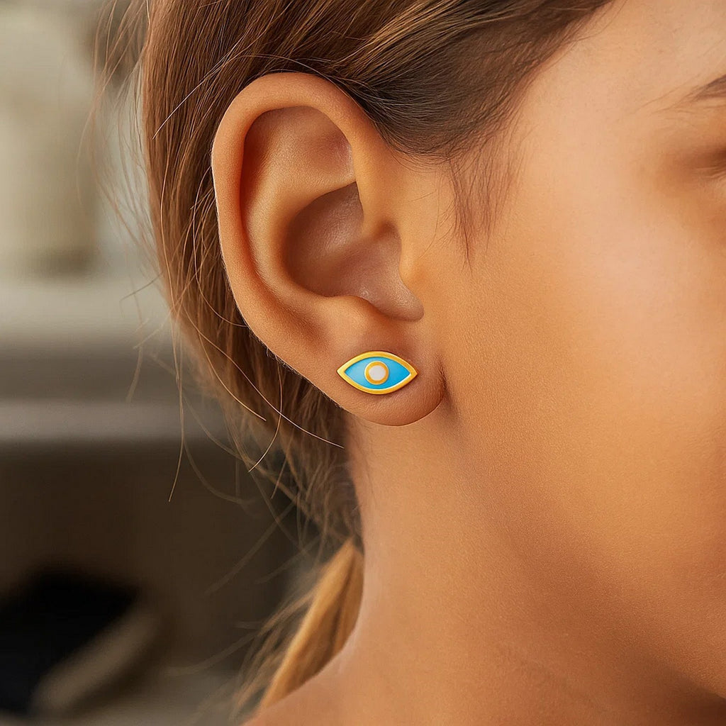 14k yellow gold dangle earrings featuring a modern blue enamel evil eye design for a chic, protective statement.