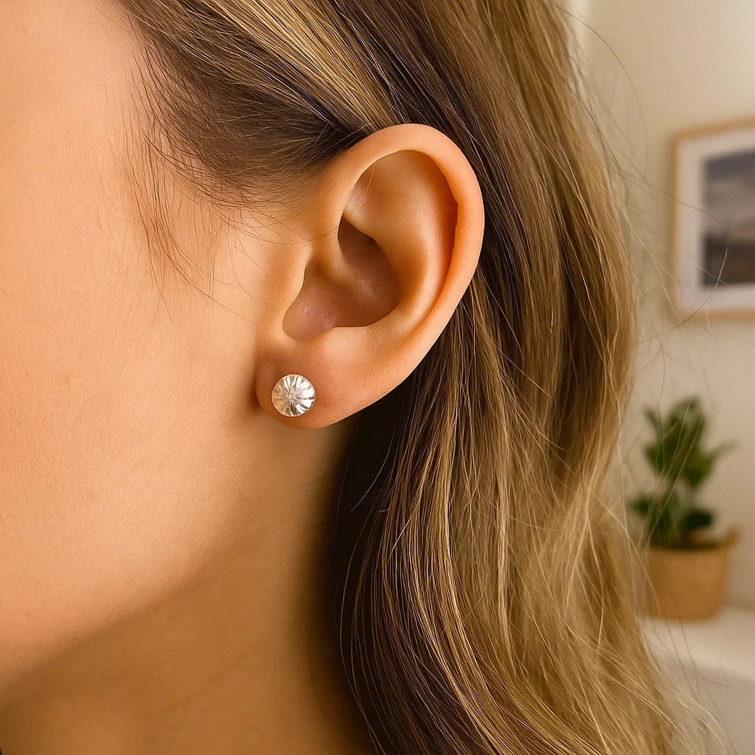 14k white gold diamond stud earrings with a modern textured design, perfect for elegant occasions.