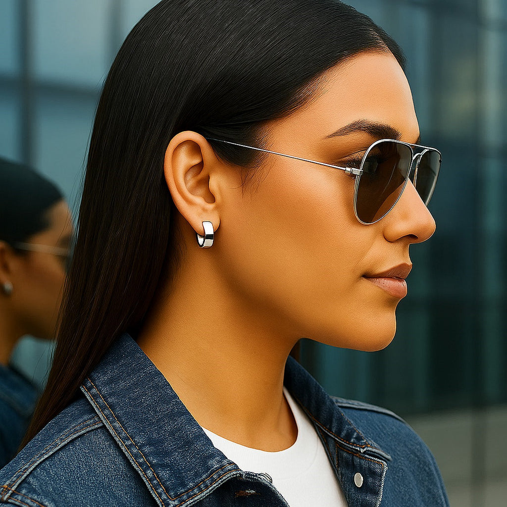 Elegant 14k white gold polished hoop earrings showcasing a sleek, timeless design for sophisticated style.