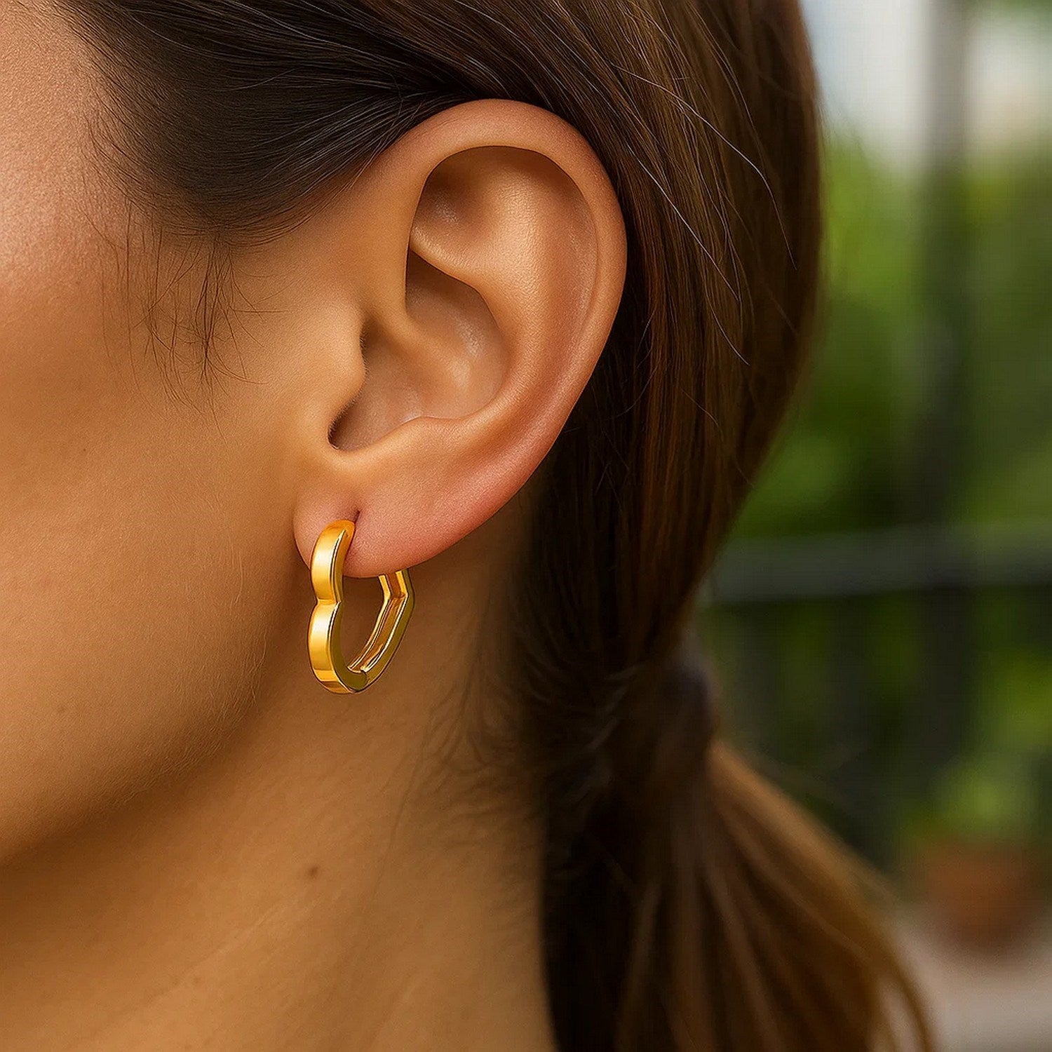 14k yellow gold huggie hoop earrings with a classic design, perfect for elegant everyday wear.